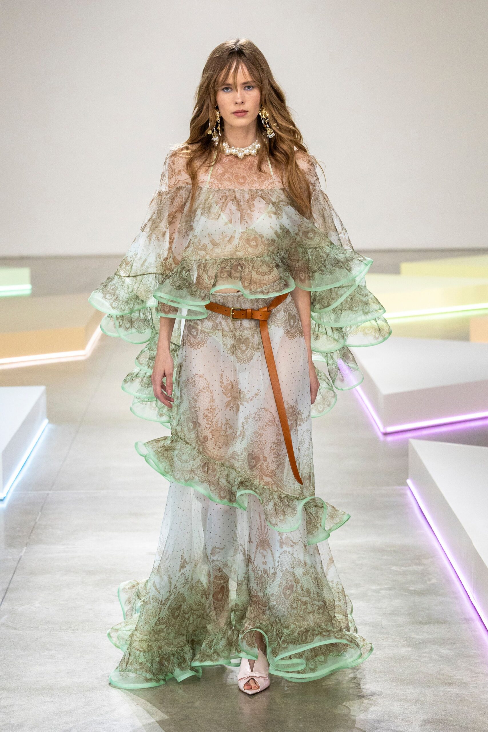 green chiffon sleeveless v-neck fitted ruffled layered gown