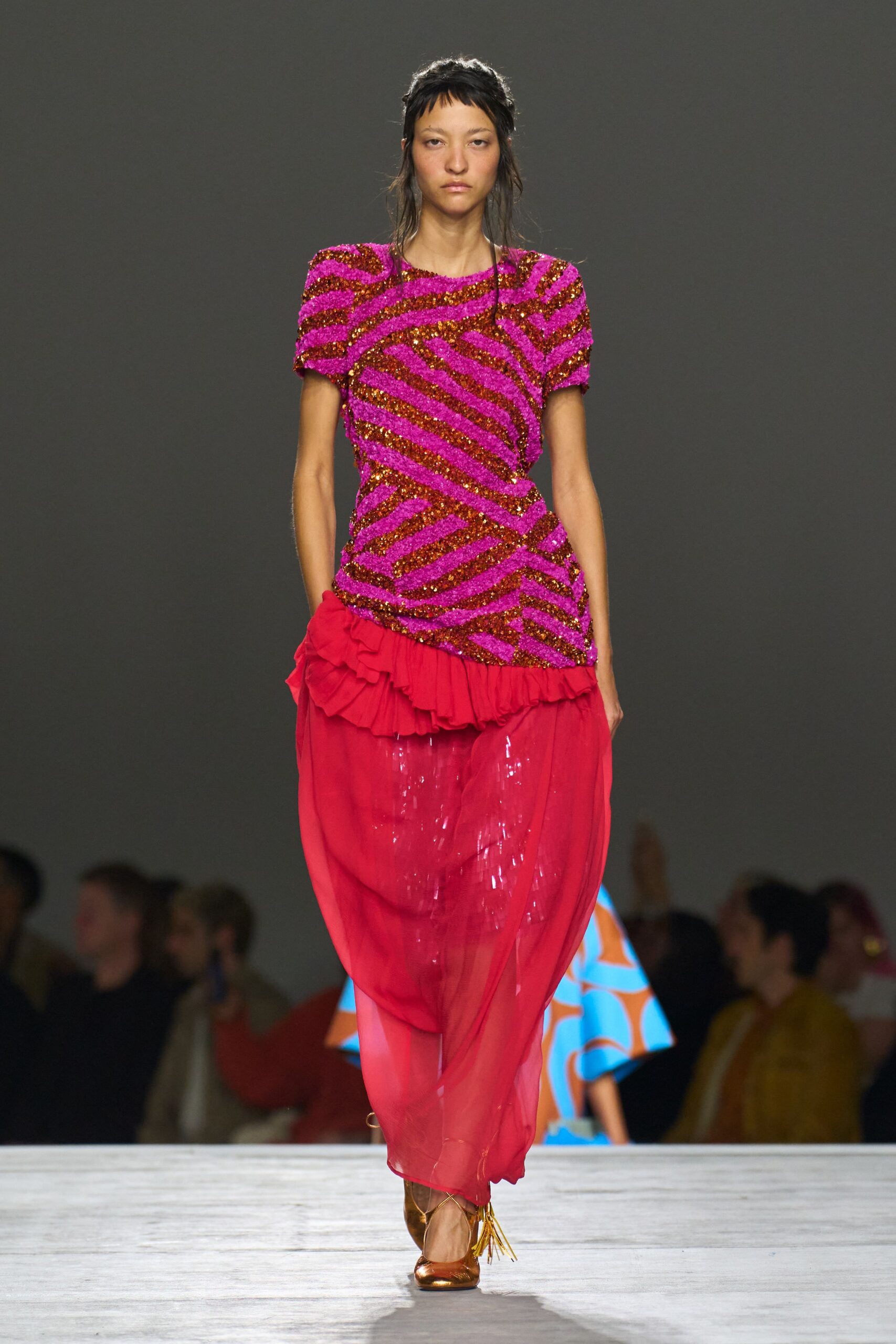 pink embellished top red tiered skirt