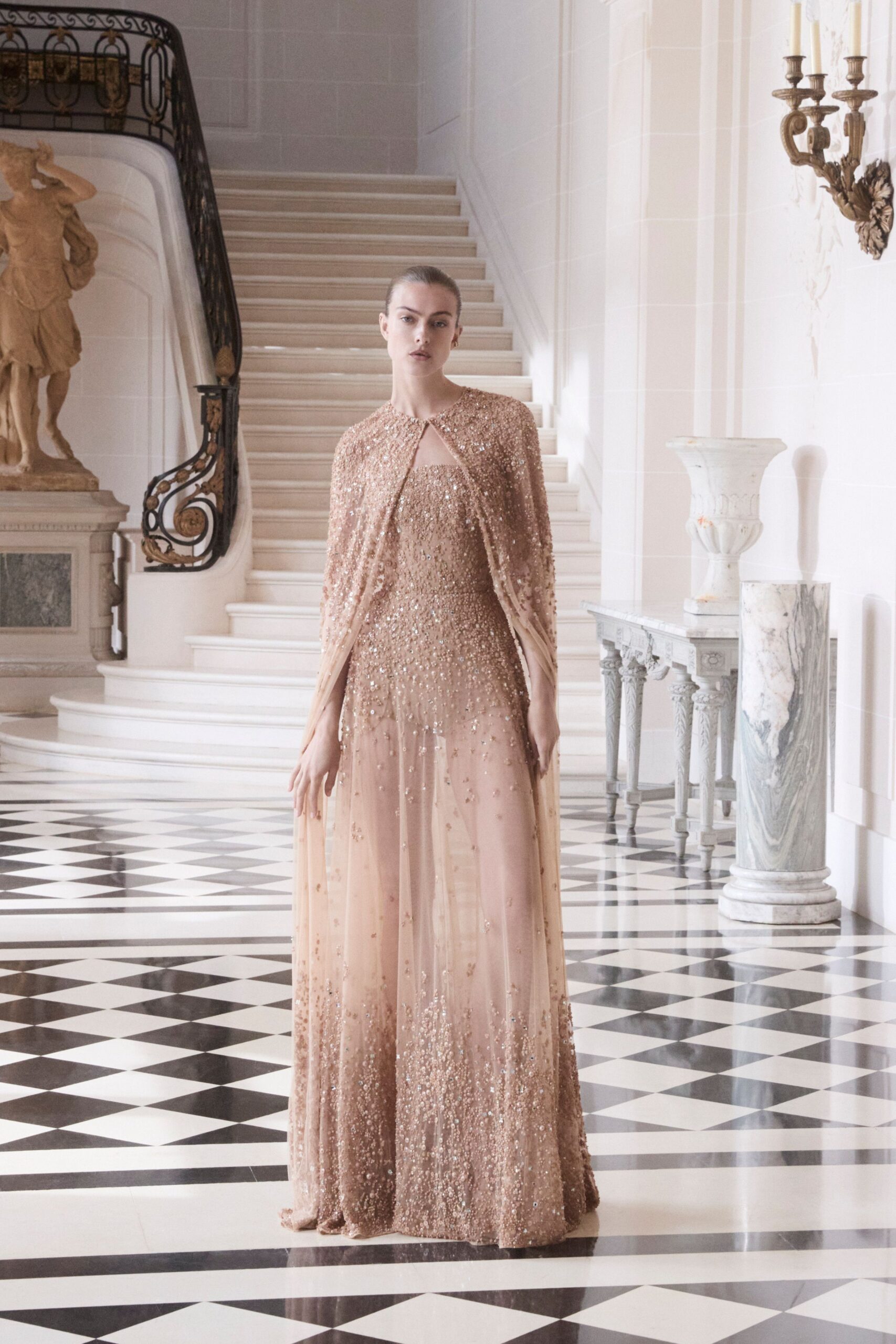 beige beaded gown with cape