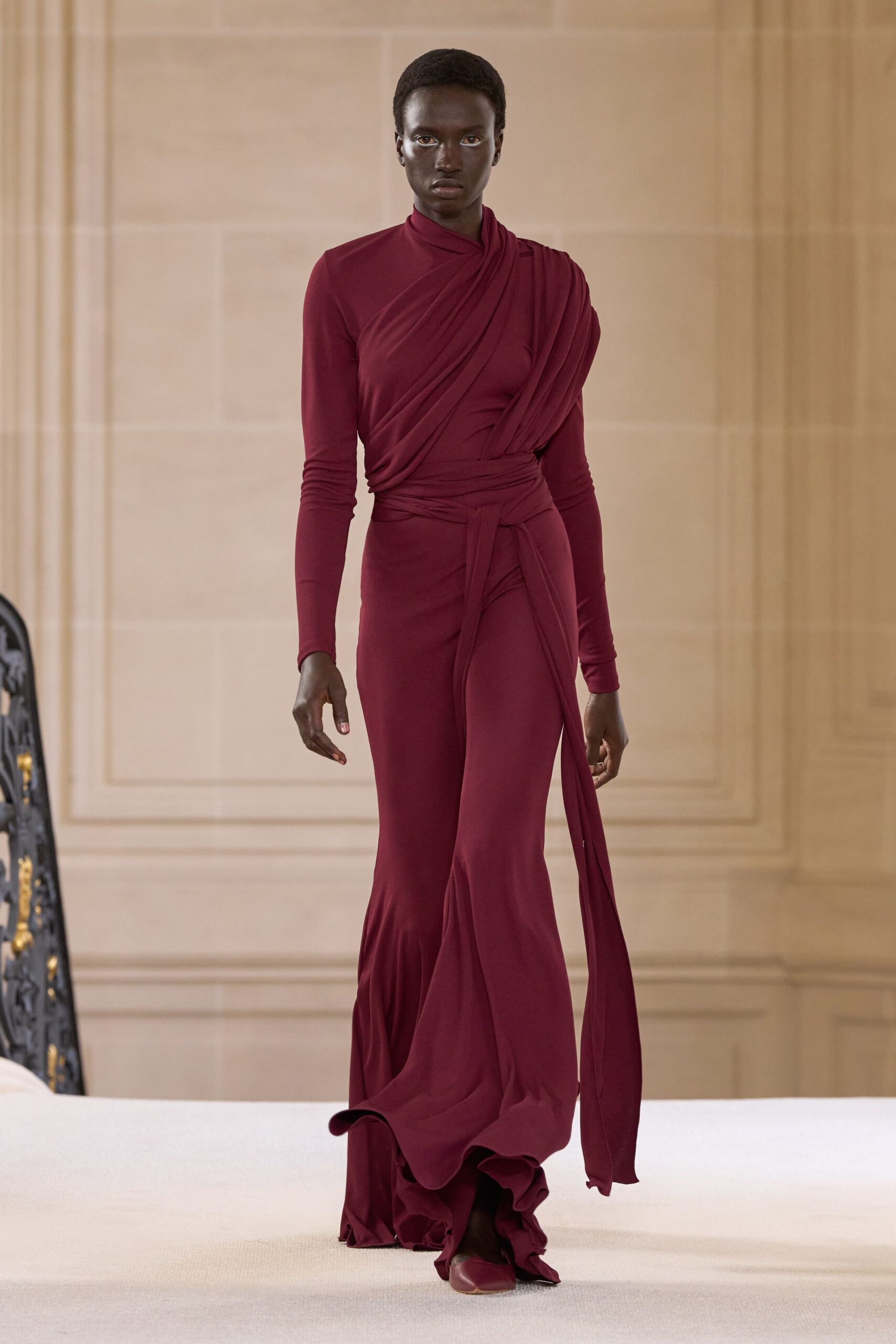 red silk long-sleeve v-neck fitted draped tiered gown