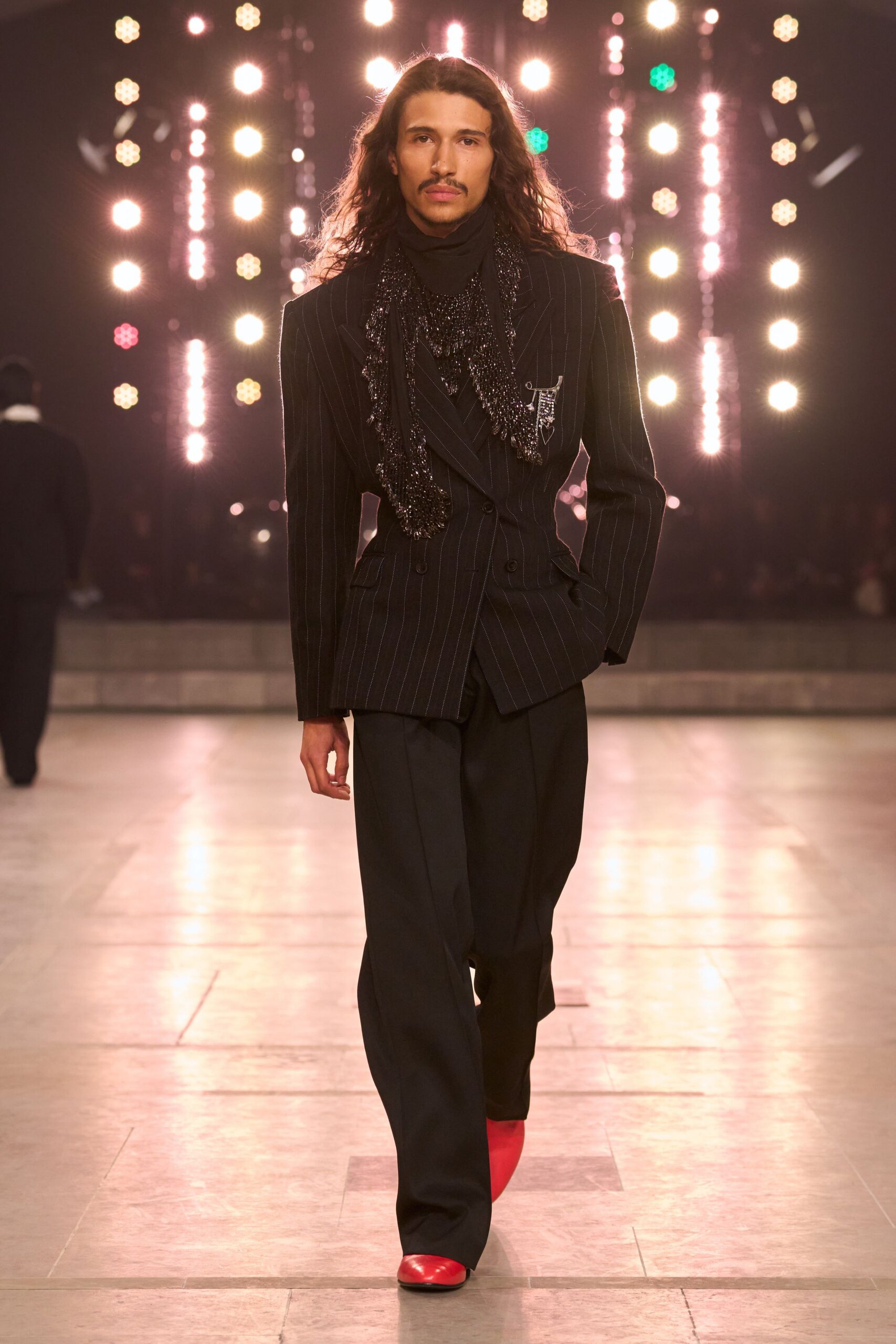 black tailored blazer with red shoes