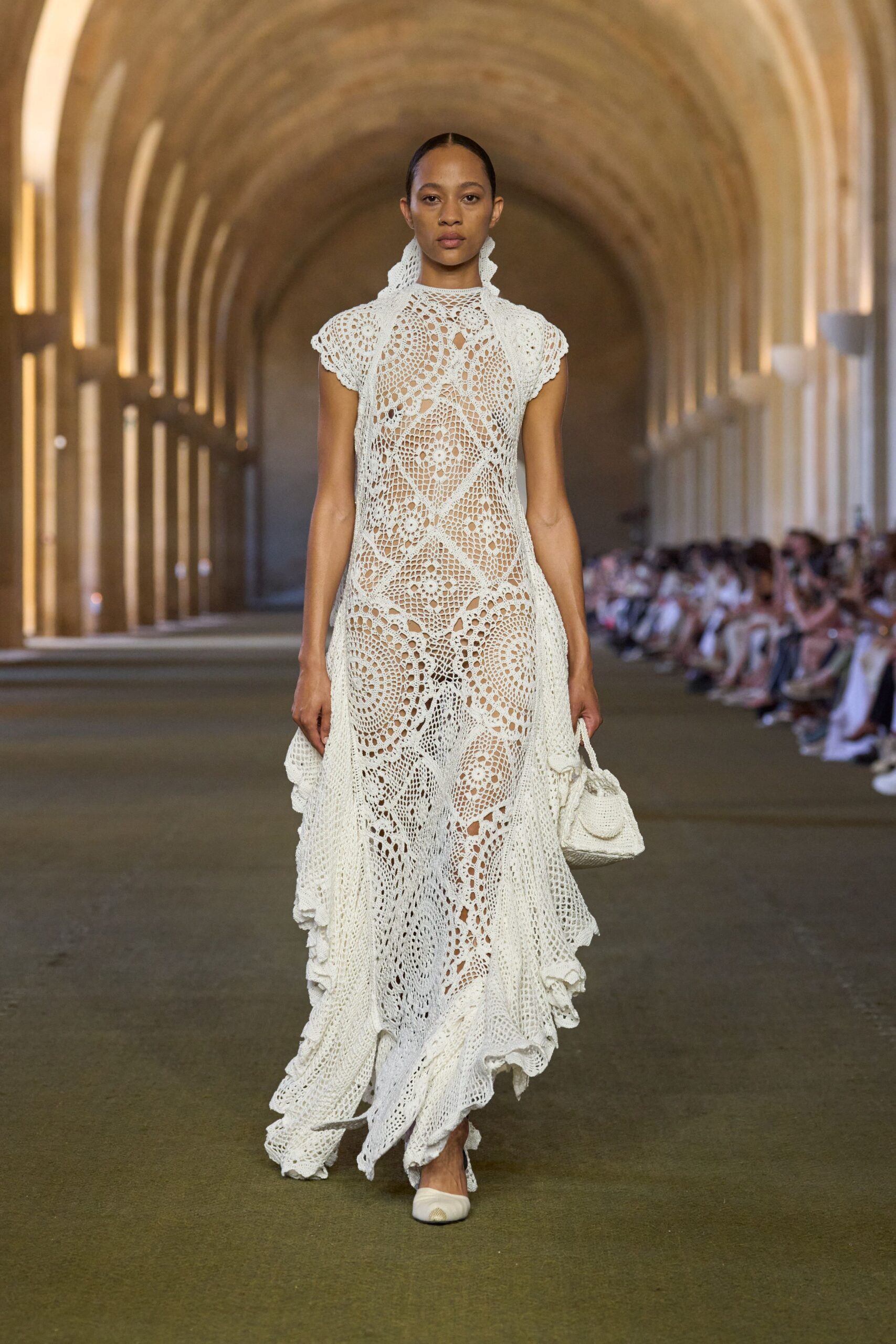 white lace sleeveless high-neck fitted tiered embroidered gown