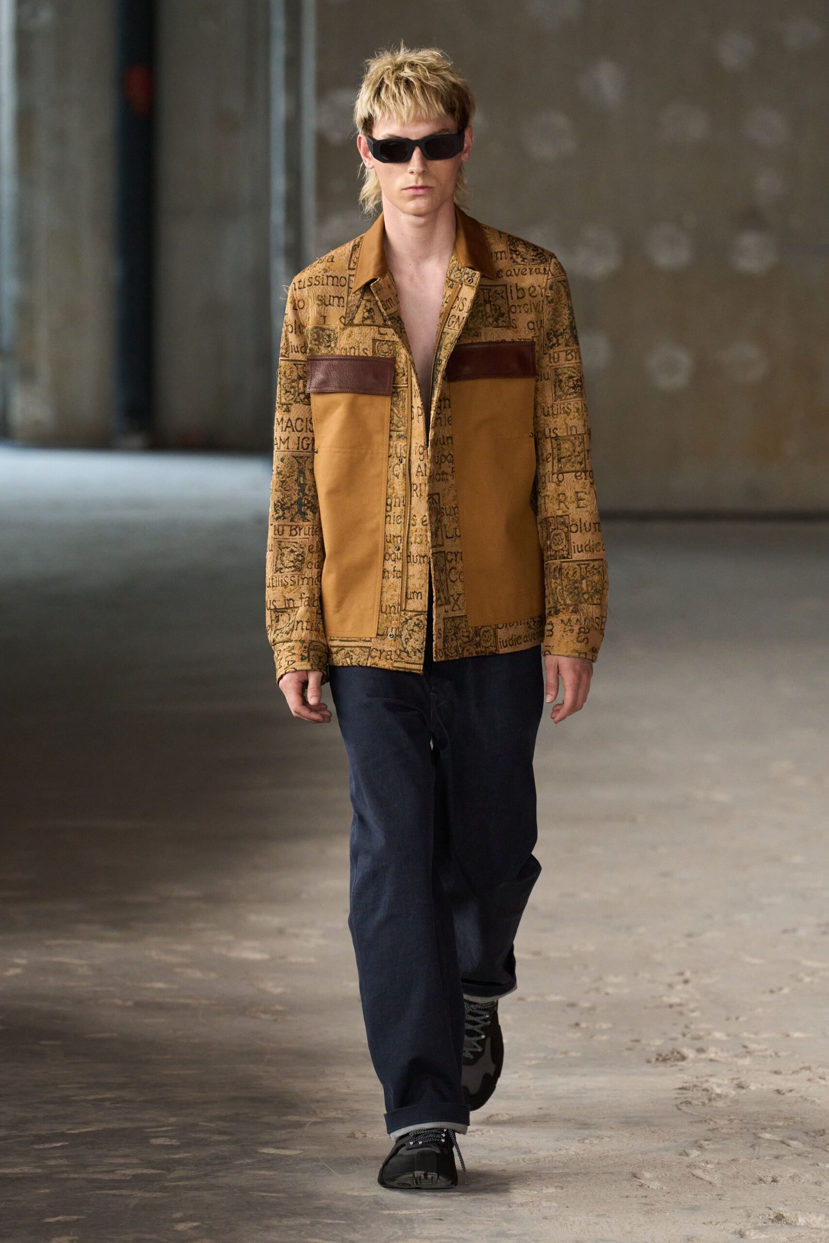 brown printed jacket with blue pants