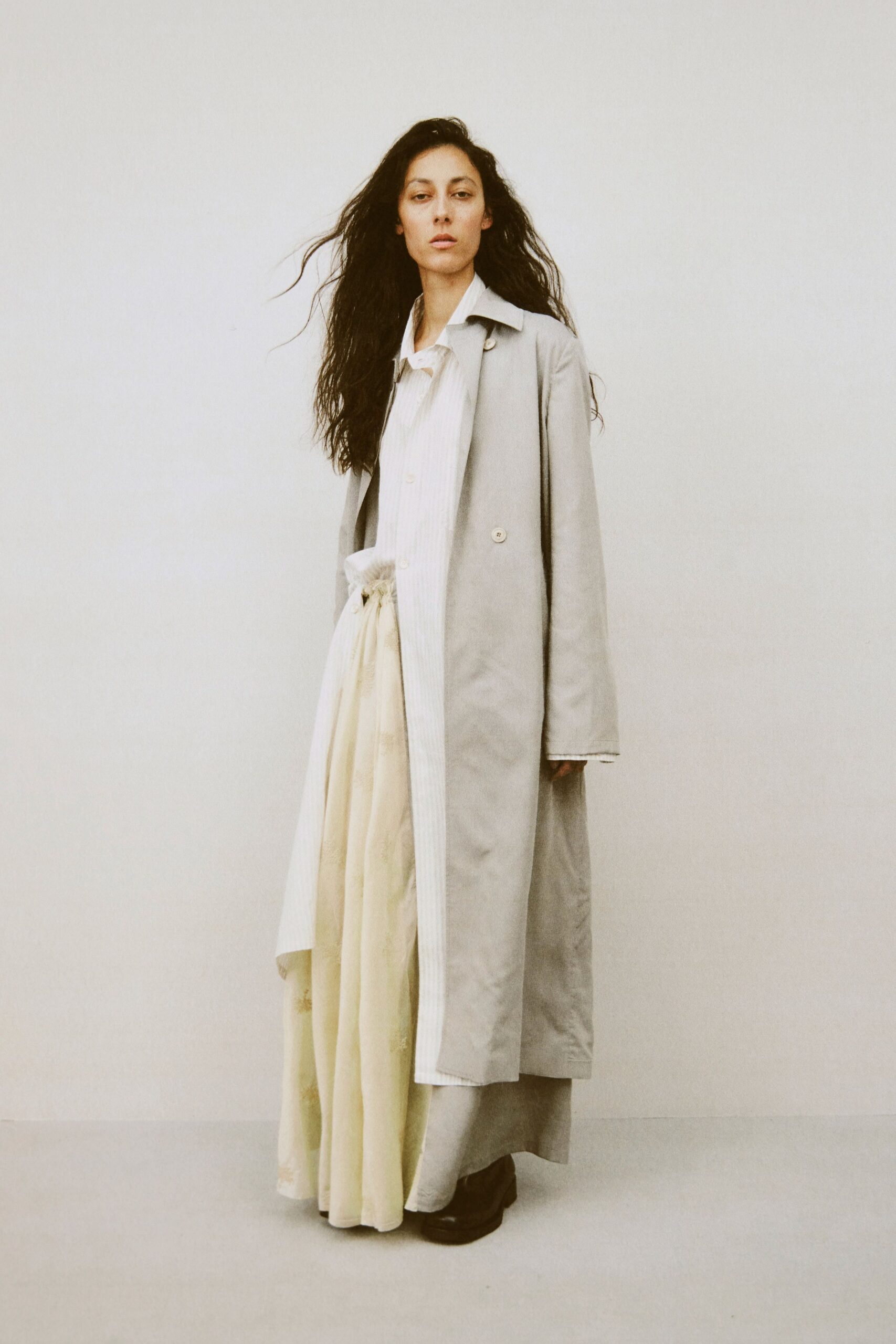 beige silk fitted high-waisted pleated flowing maxi skirt
