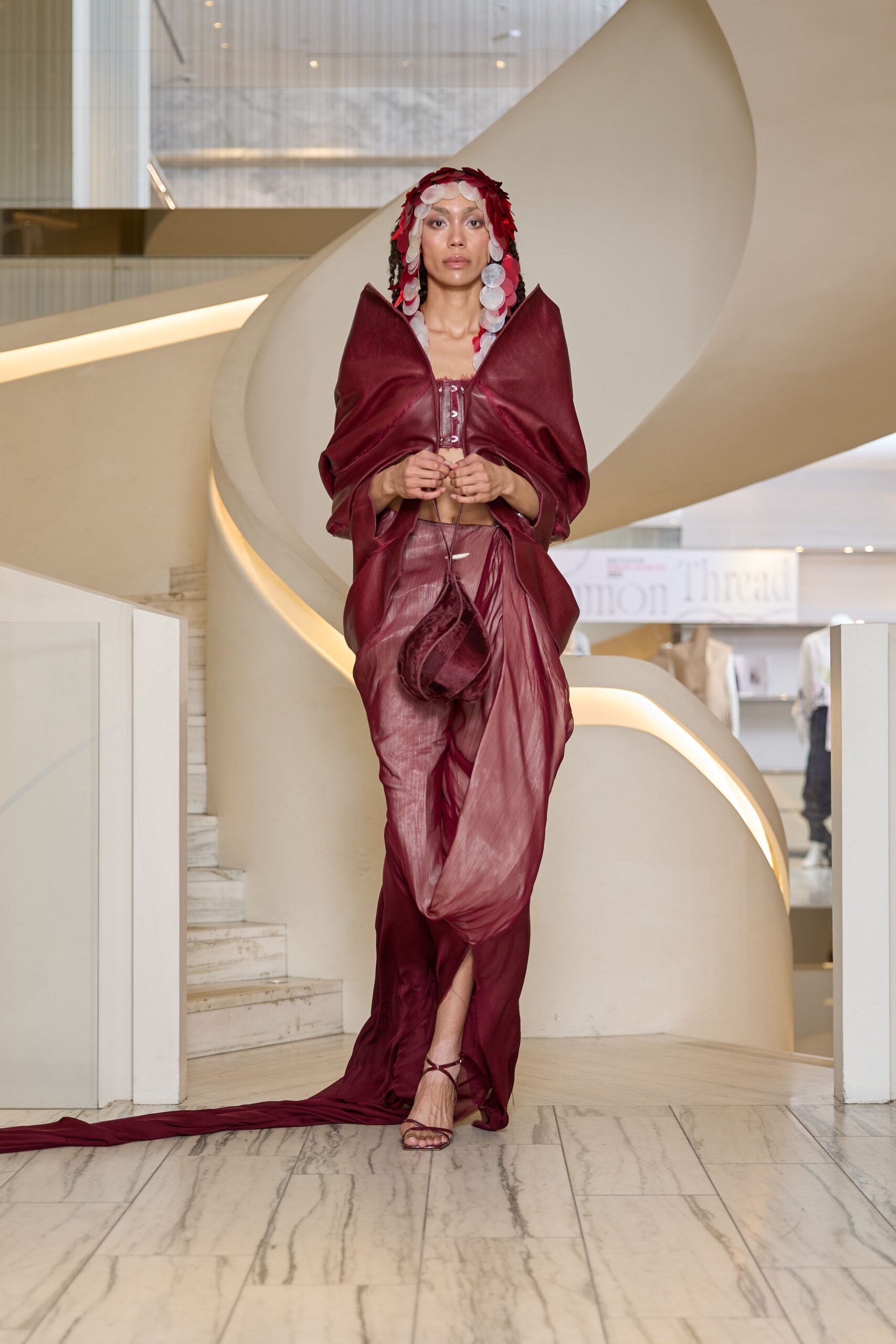 red silk sleeveless v-neck fitted draped flowing gown