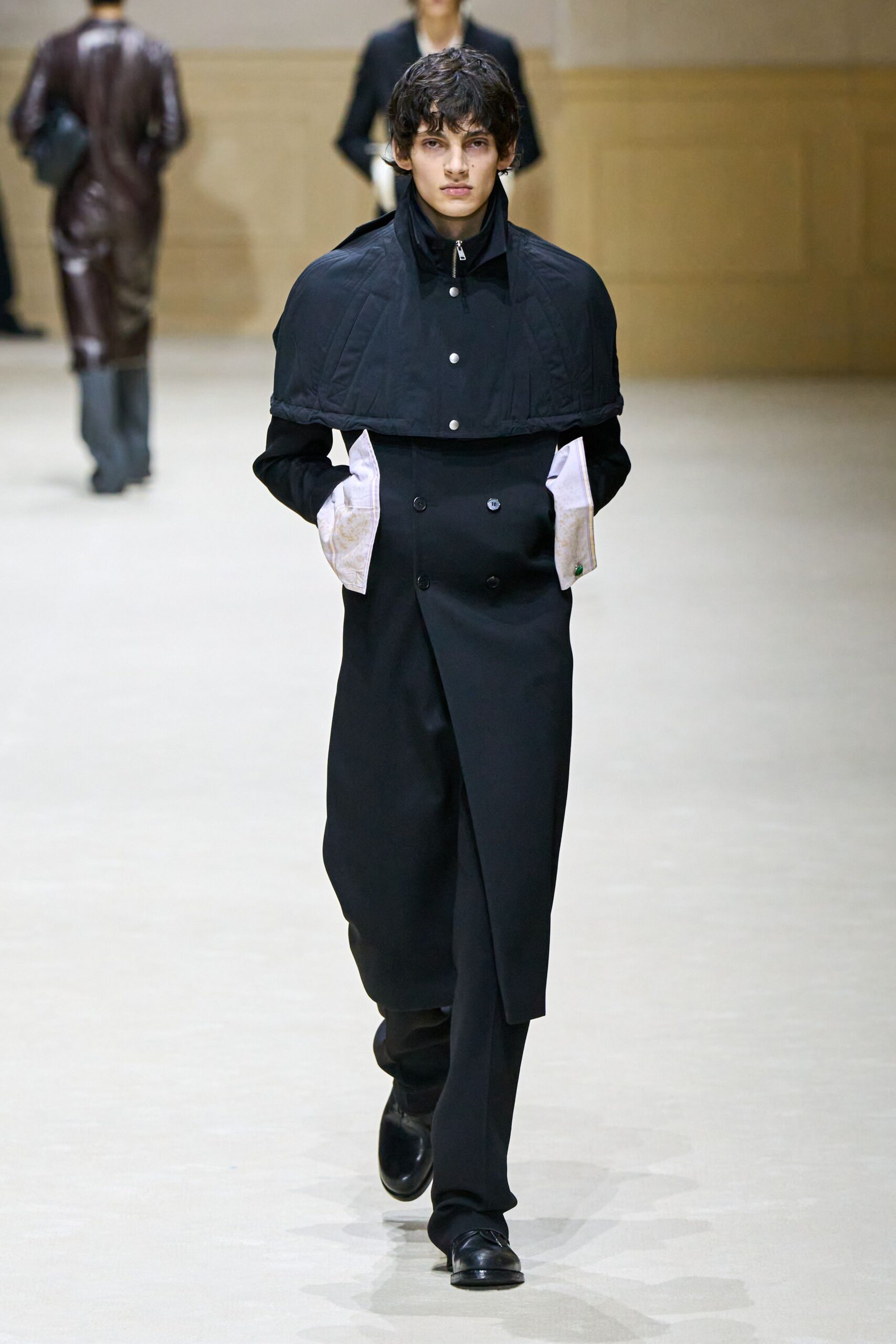 black cotton long-sleeve collared structured zippered layered coat