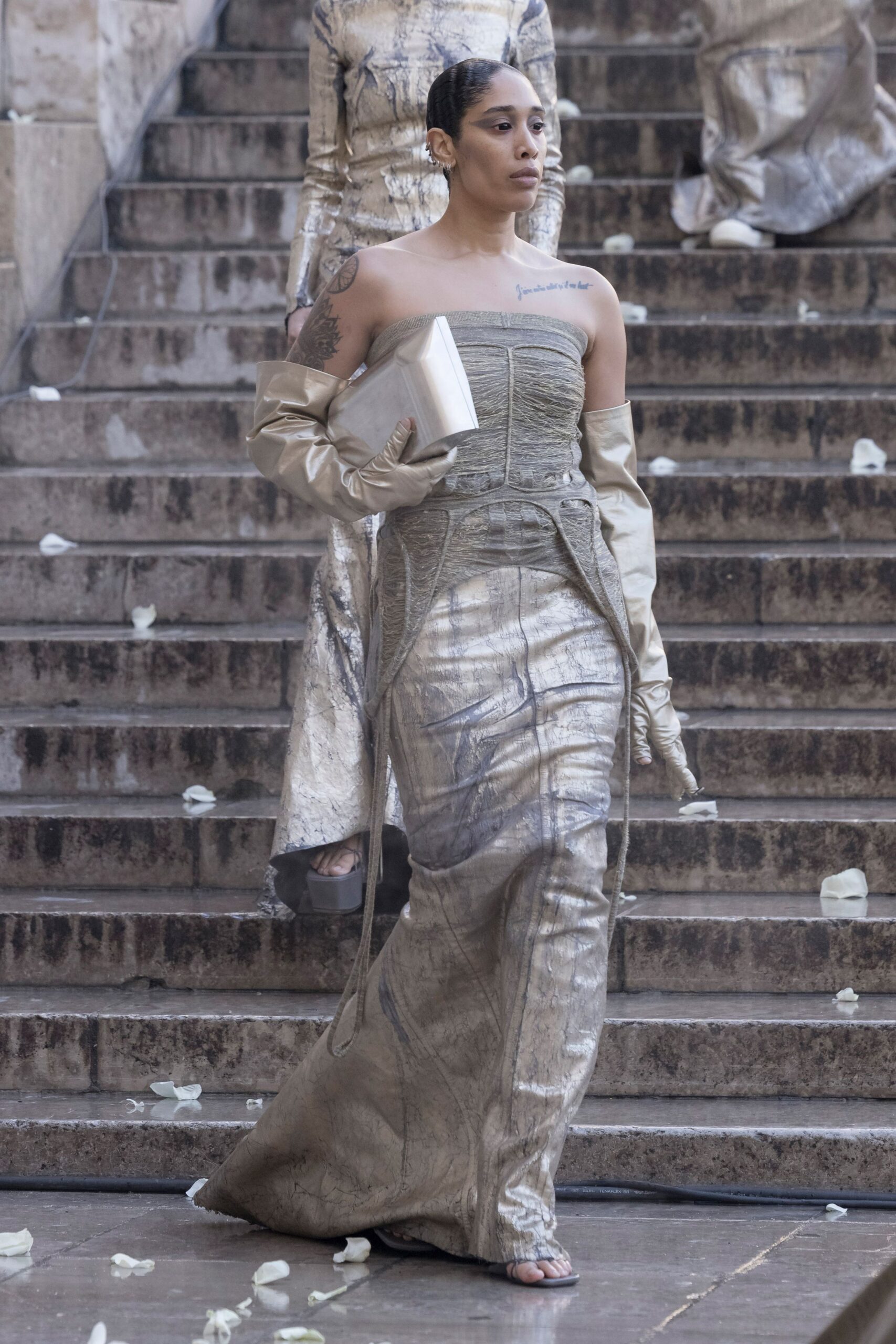 gold silk sleeveless off-shoulder fitted ruched draped gown