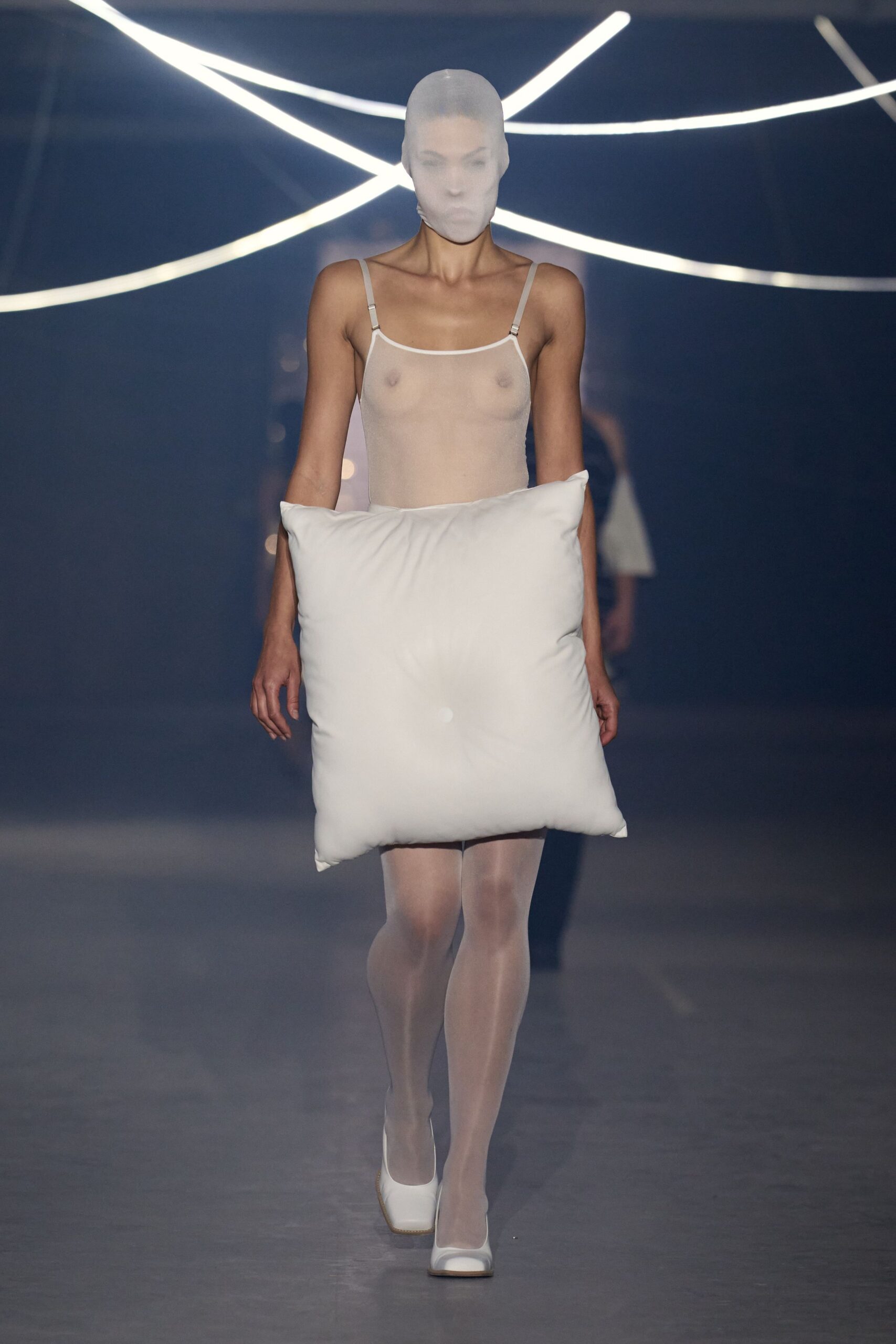 white sheer bodysuit with pillow accessory