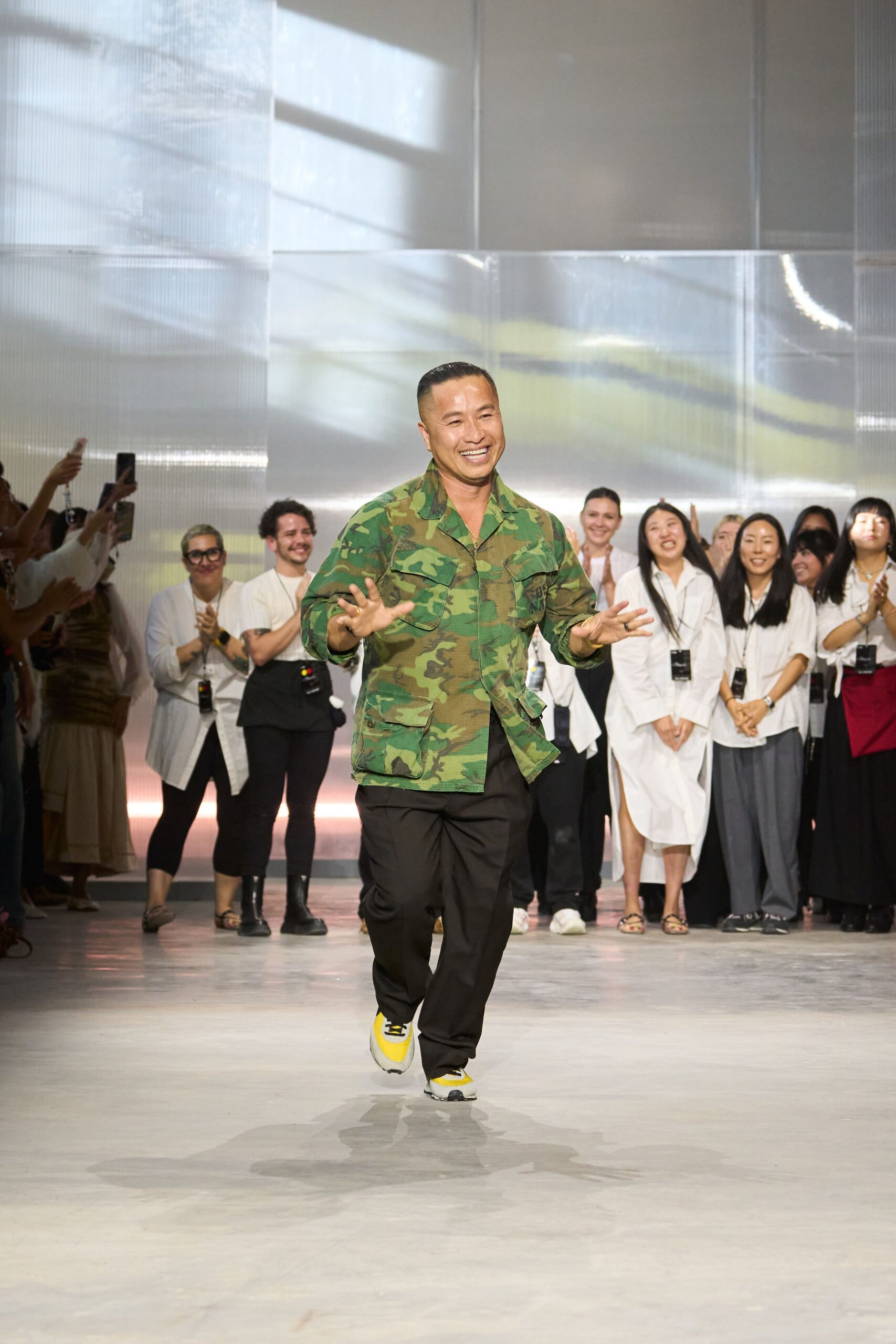 green camouflage jacket with black pants