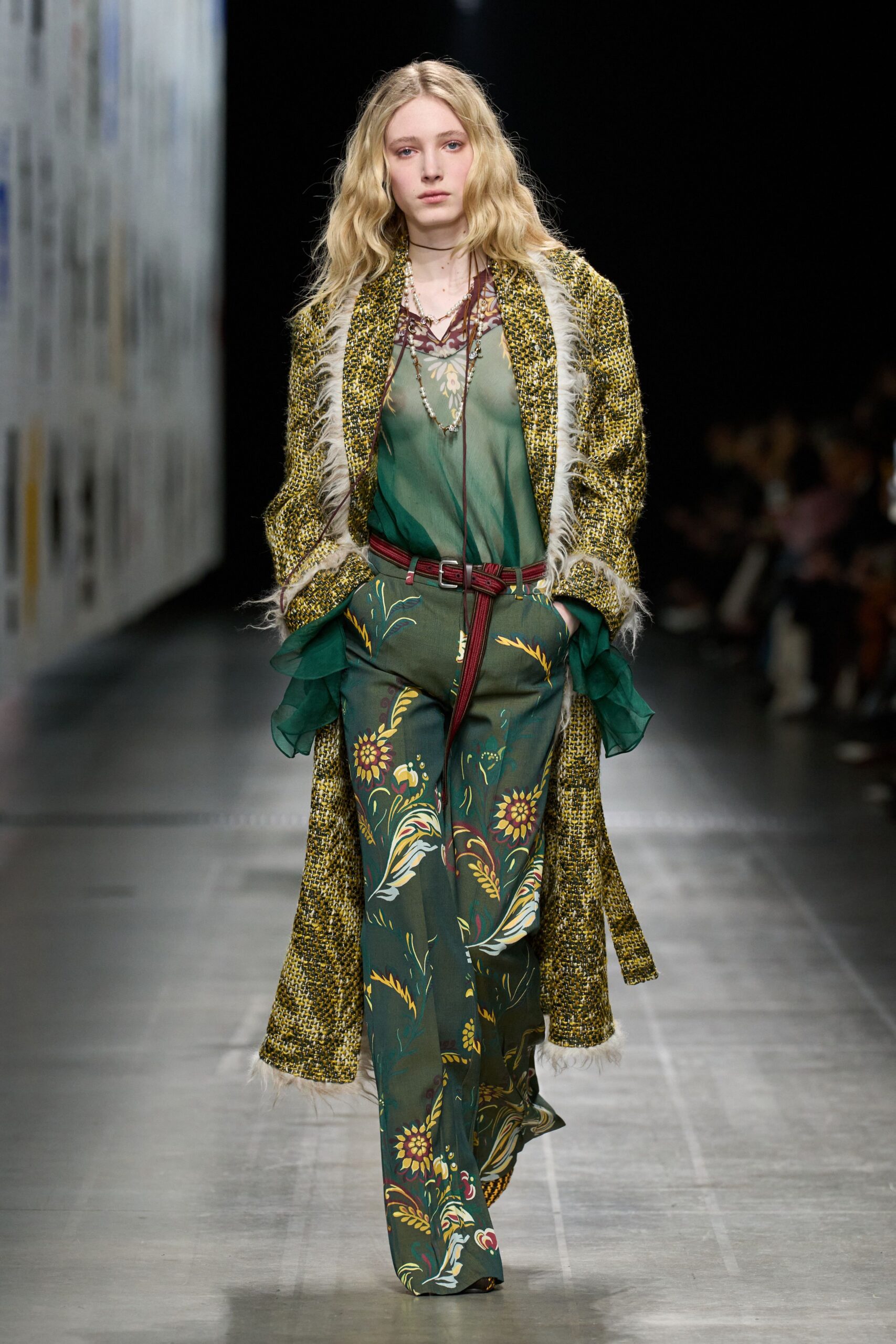 green floral coat with red belt
