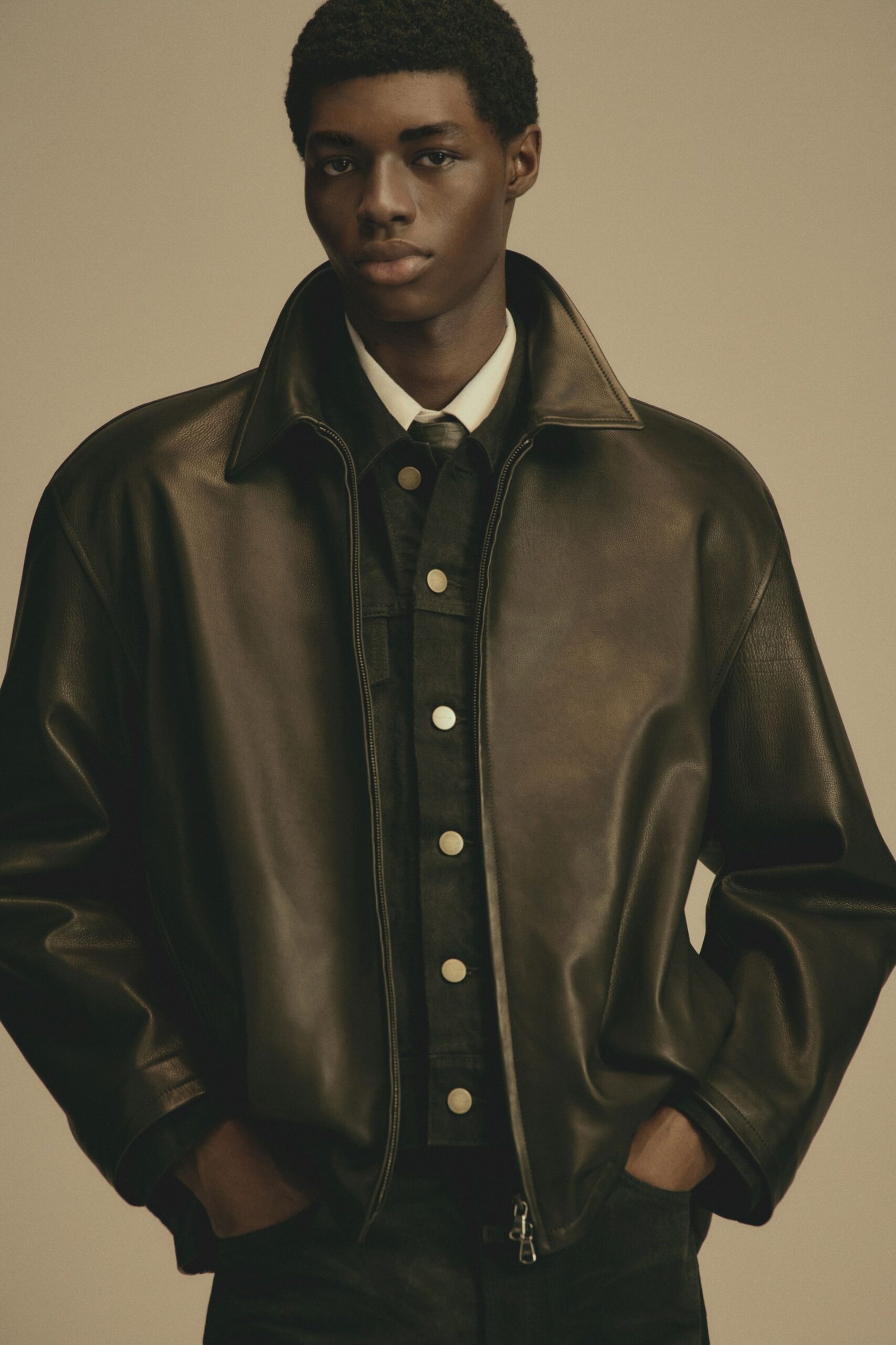 black leather relaxed jacket and white shirt