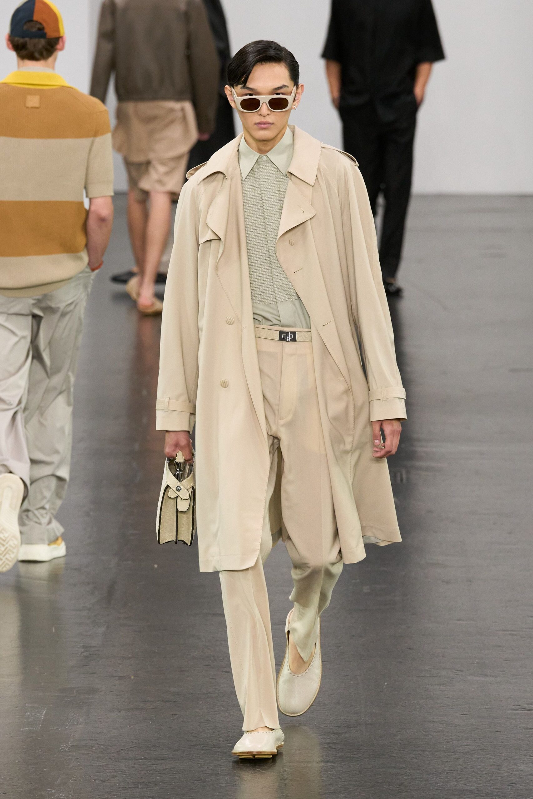 beige trench coat with tailored pants