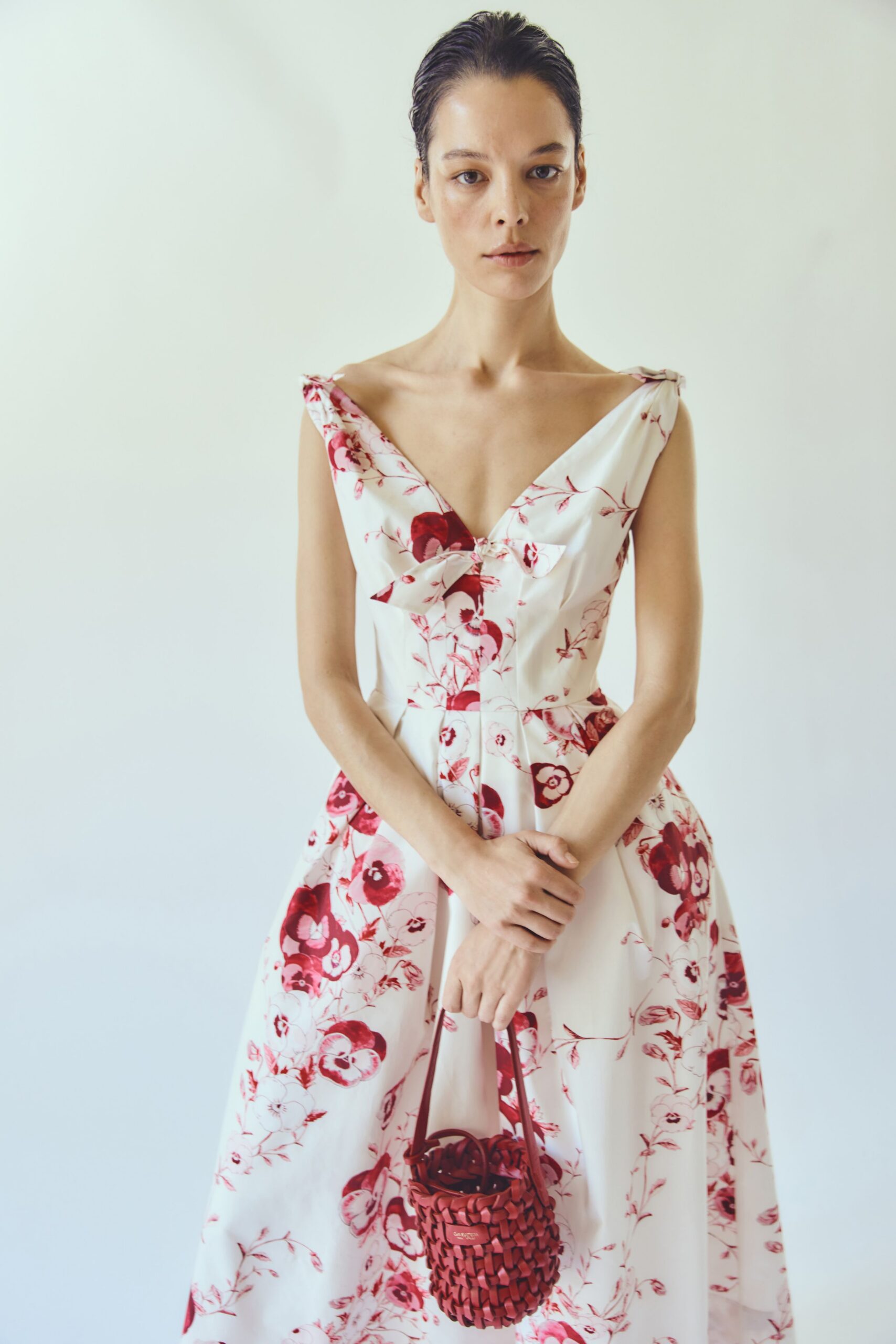 floral midi dress with red bag