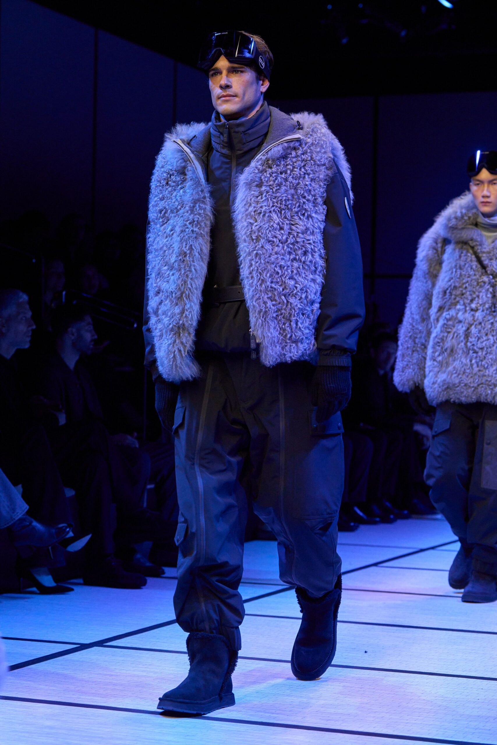 gray faux-fur jacket with black pants