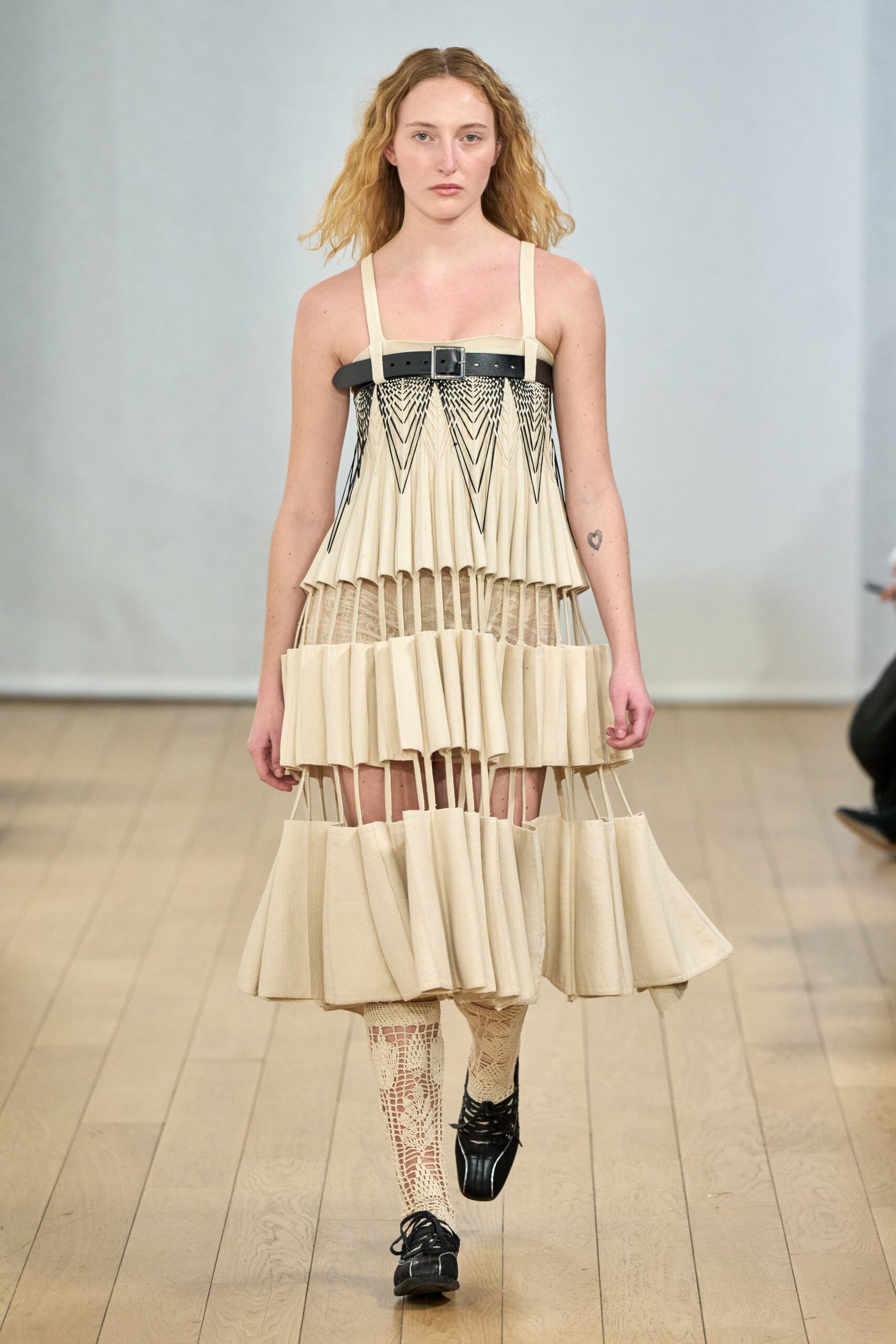 beige pleated midi dress with black shoes