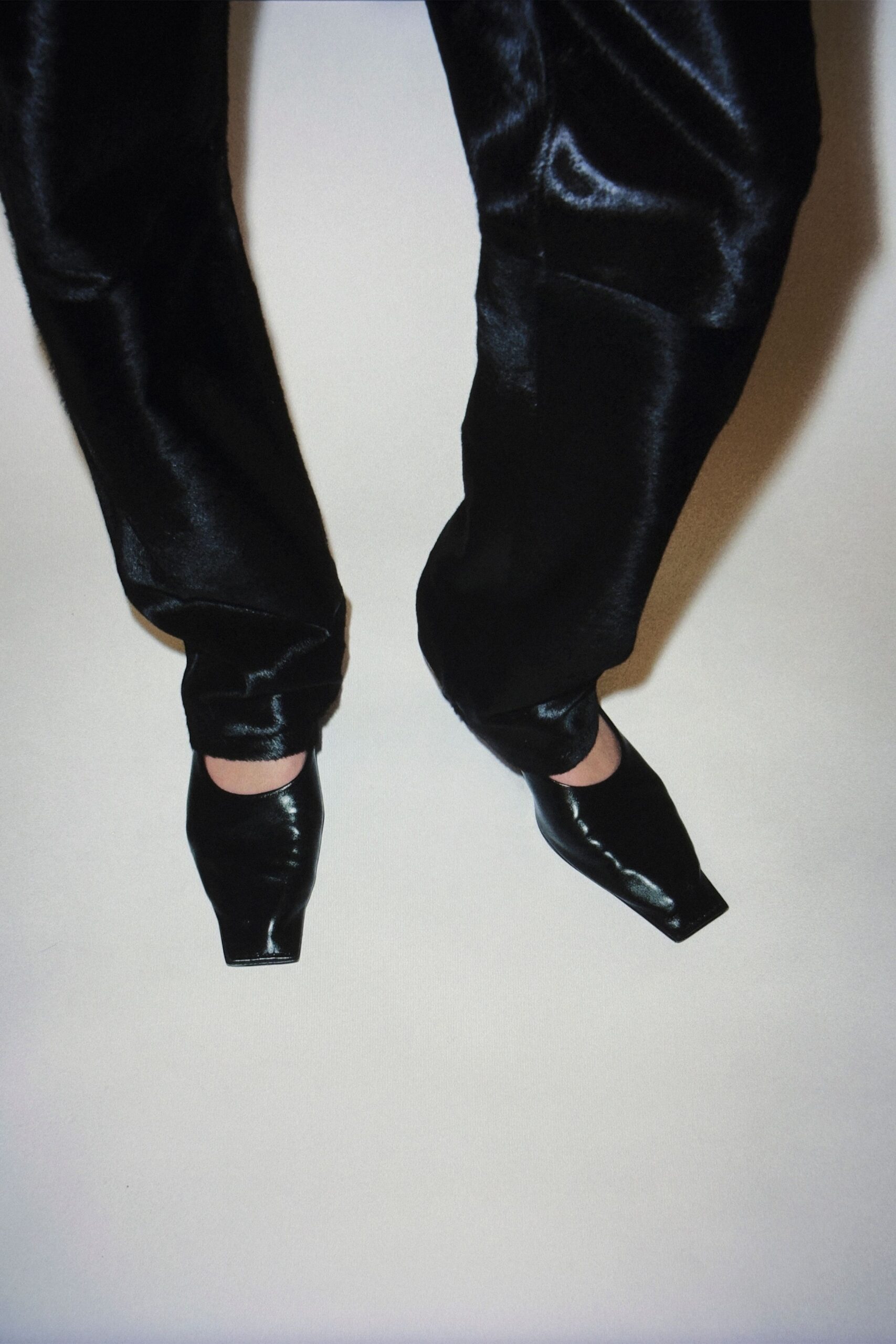 black silk fitted pants and heels