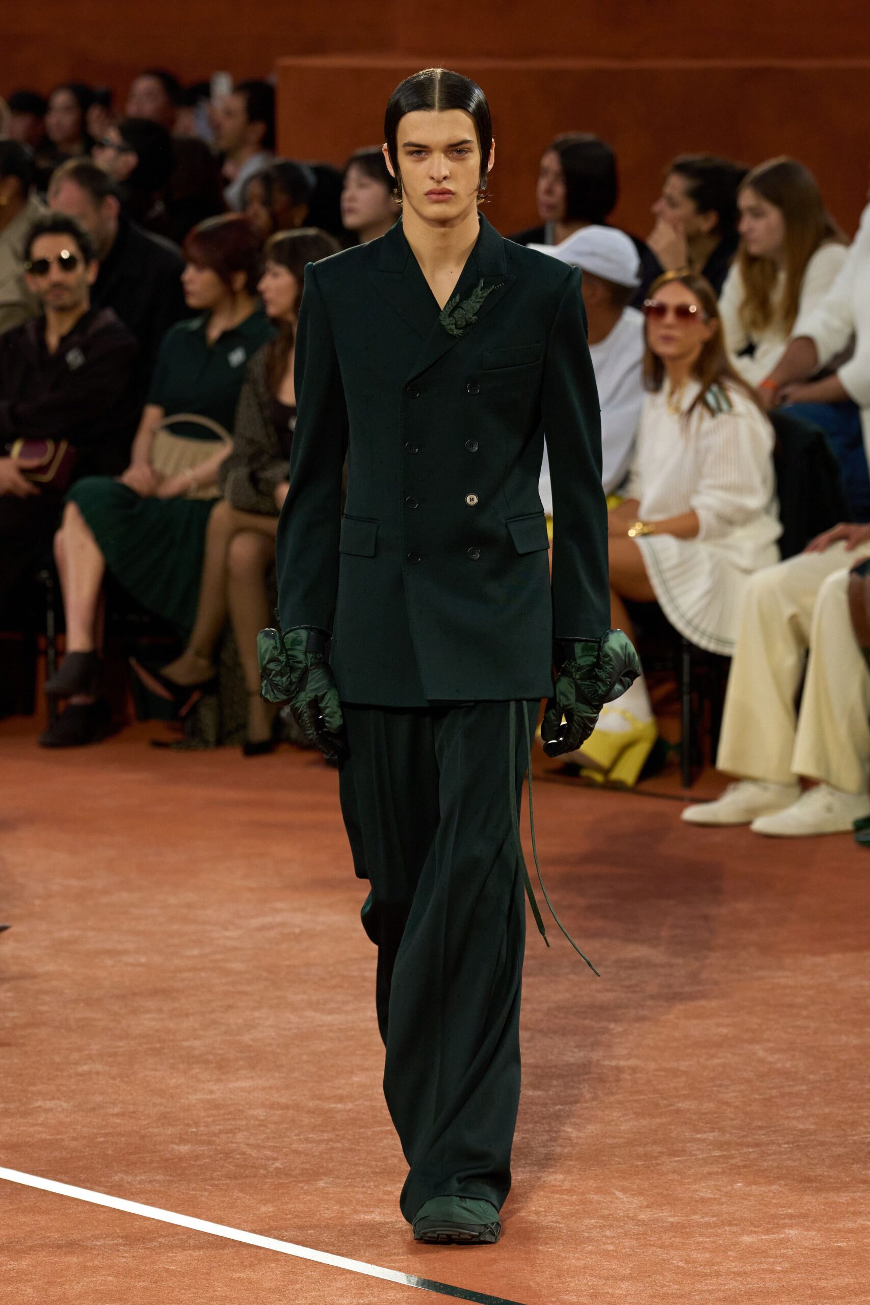 dark green tailored suit with gloves