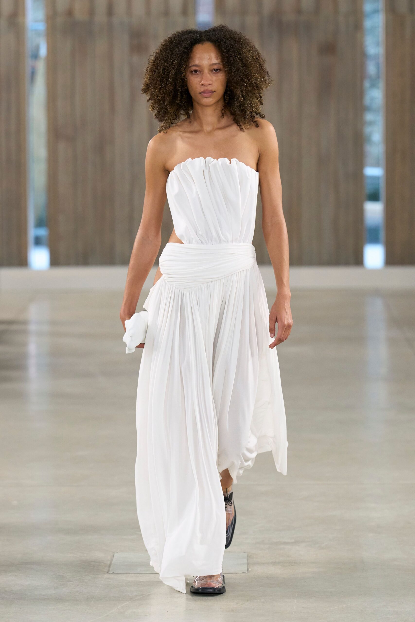 white silk strapless fitted pleated flowing maxi gown