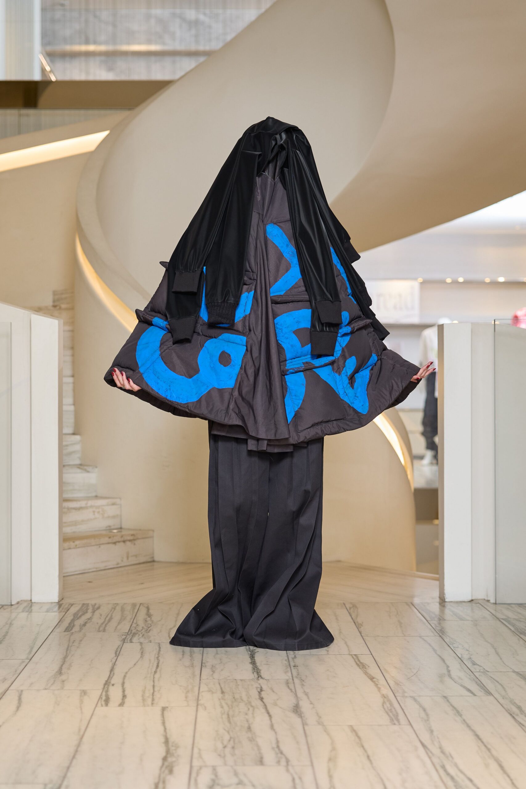 black cape with blue print