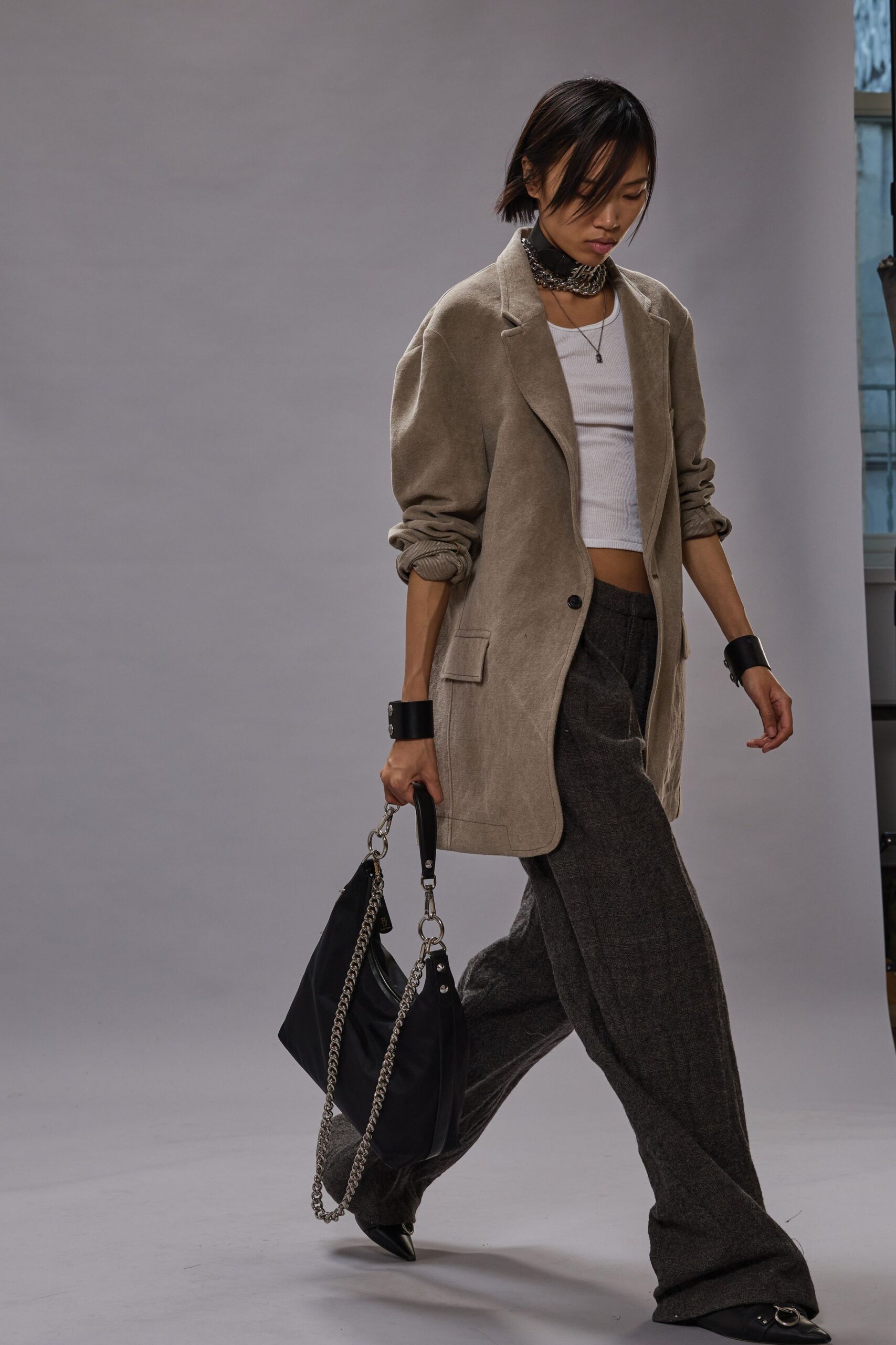 beige blazer white top gray pants