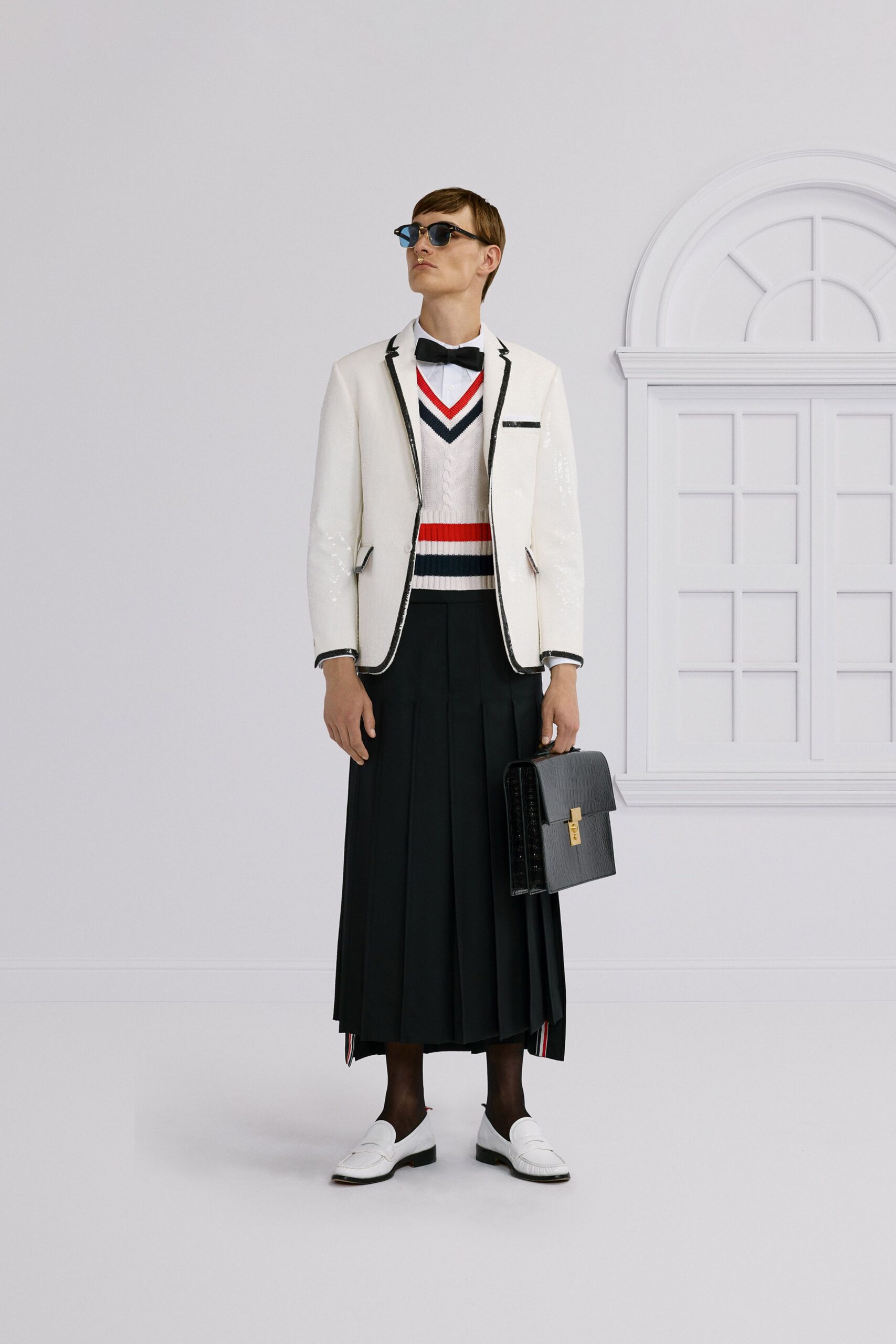 white tailored blazer with pleated skirt