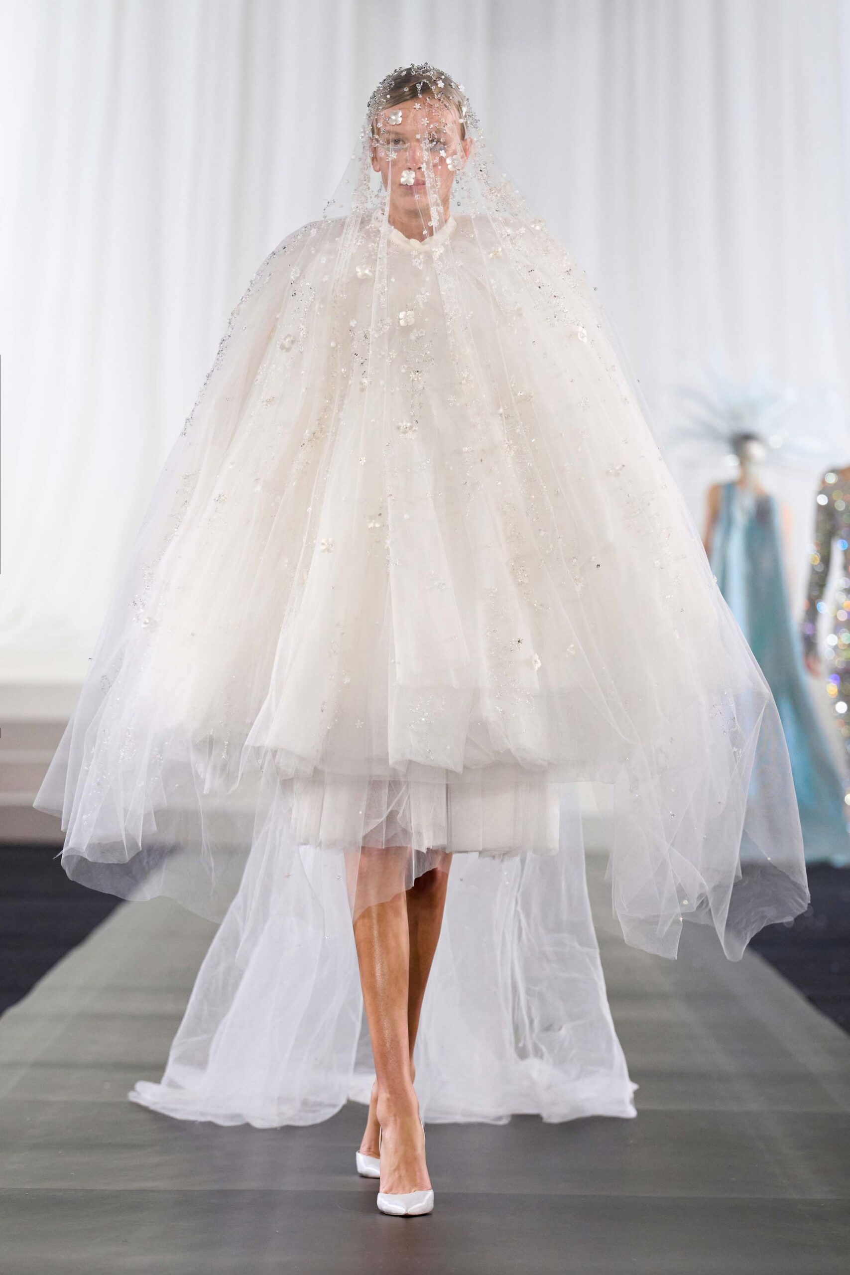 white embellished cape and dress