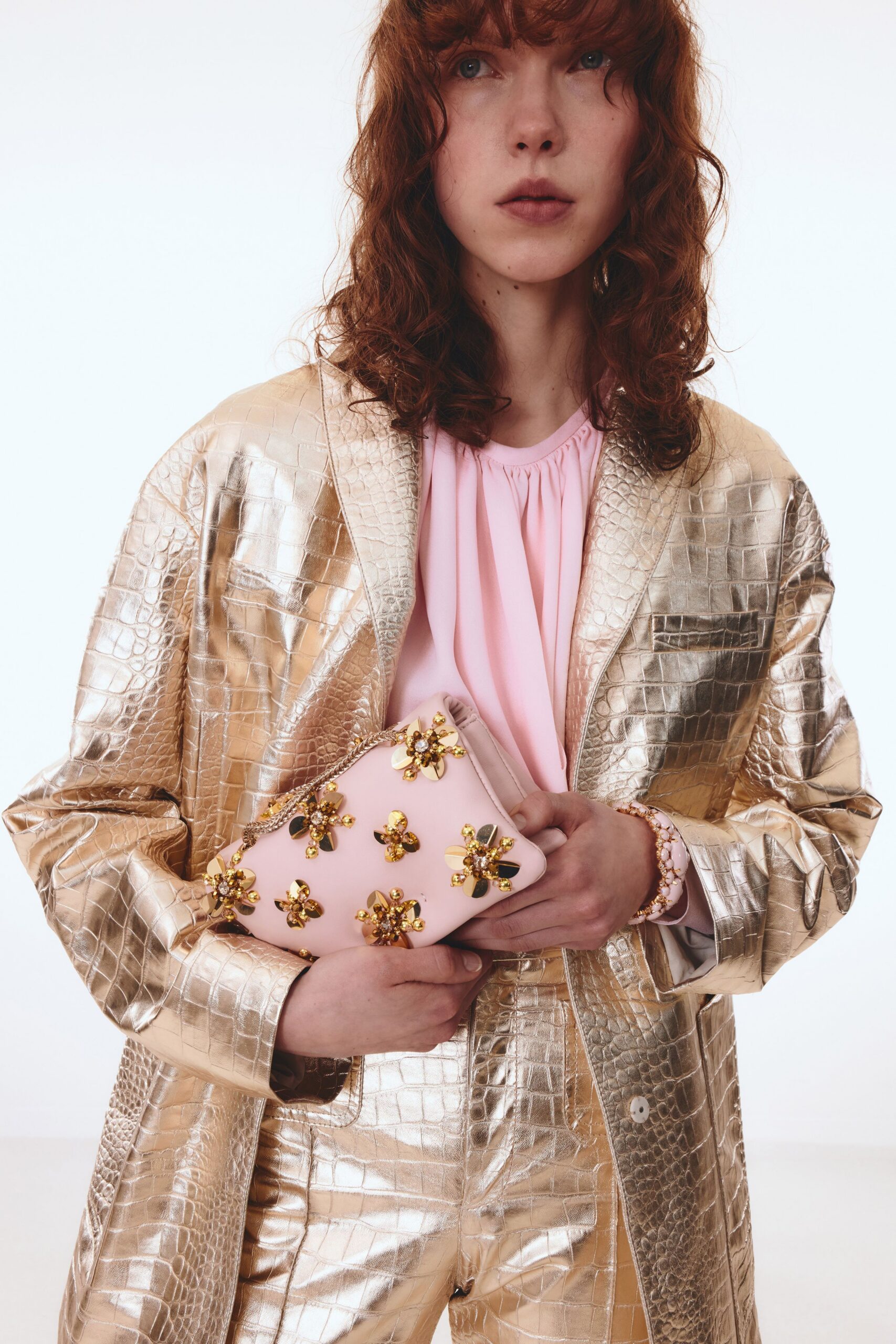gold tailored blazer with pink top