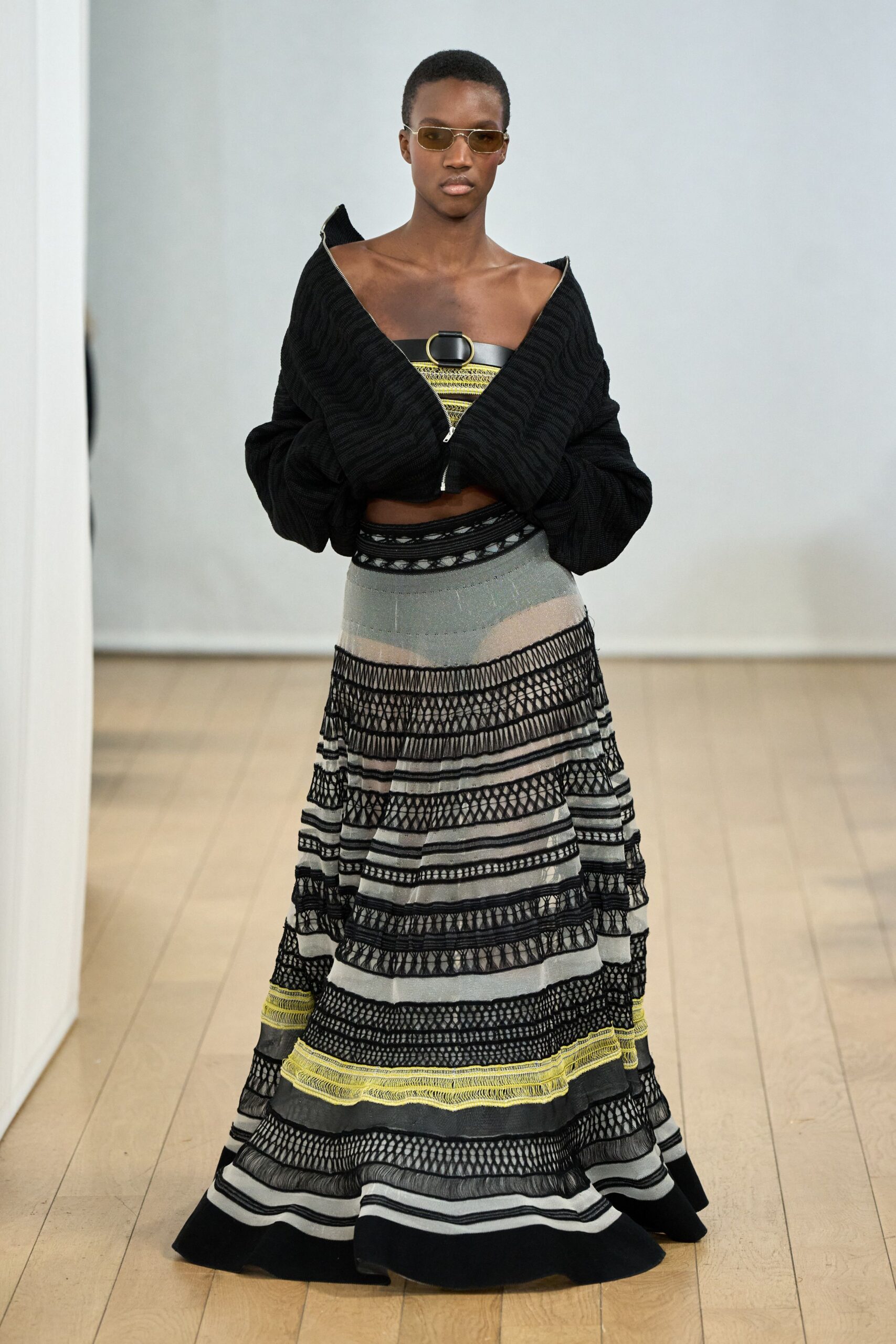 black knit top and multi striped maxi skirt