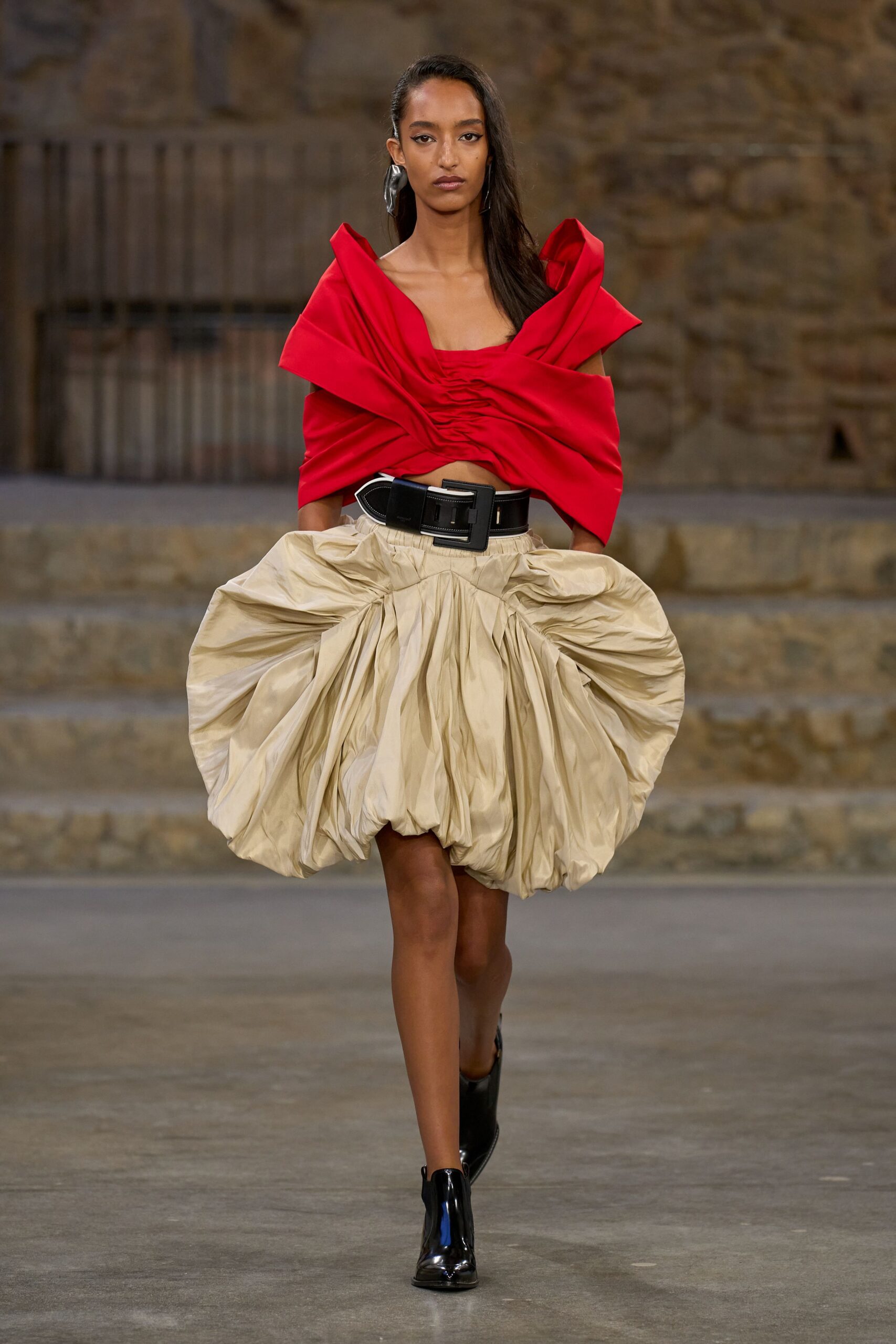 red silk top beige pleated skirt