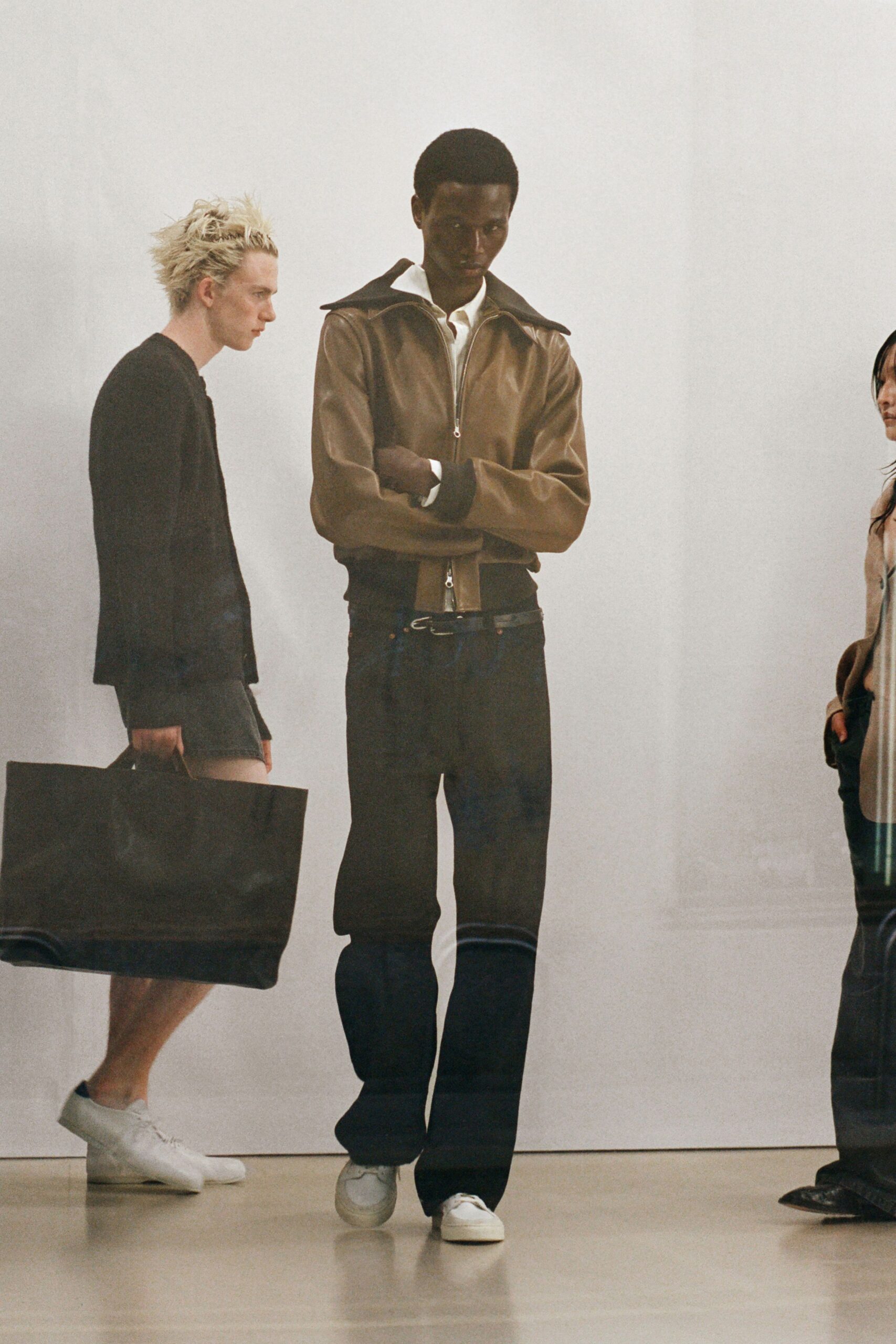 brown leather jacket with denim pants