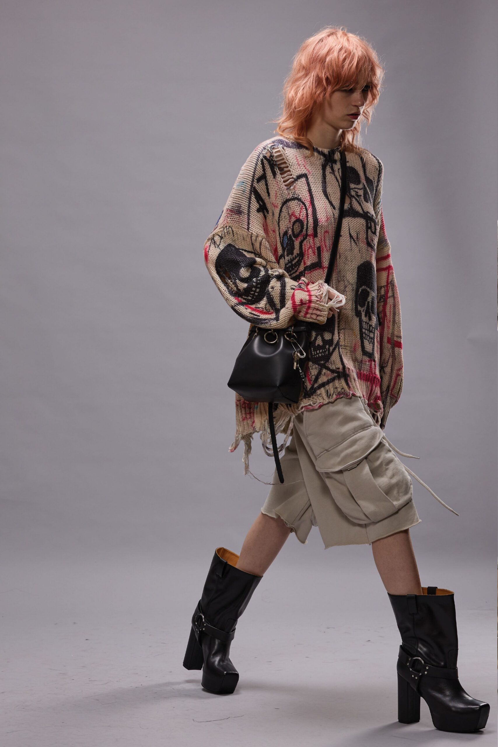 beige graphic sweater with cargo shorts