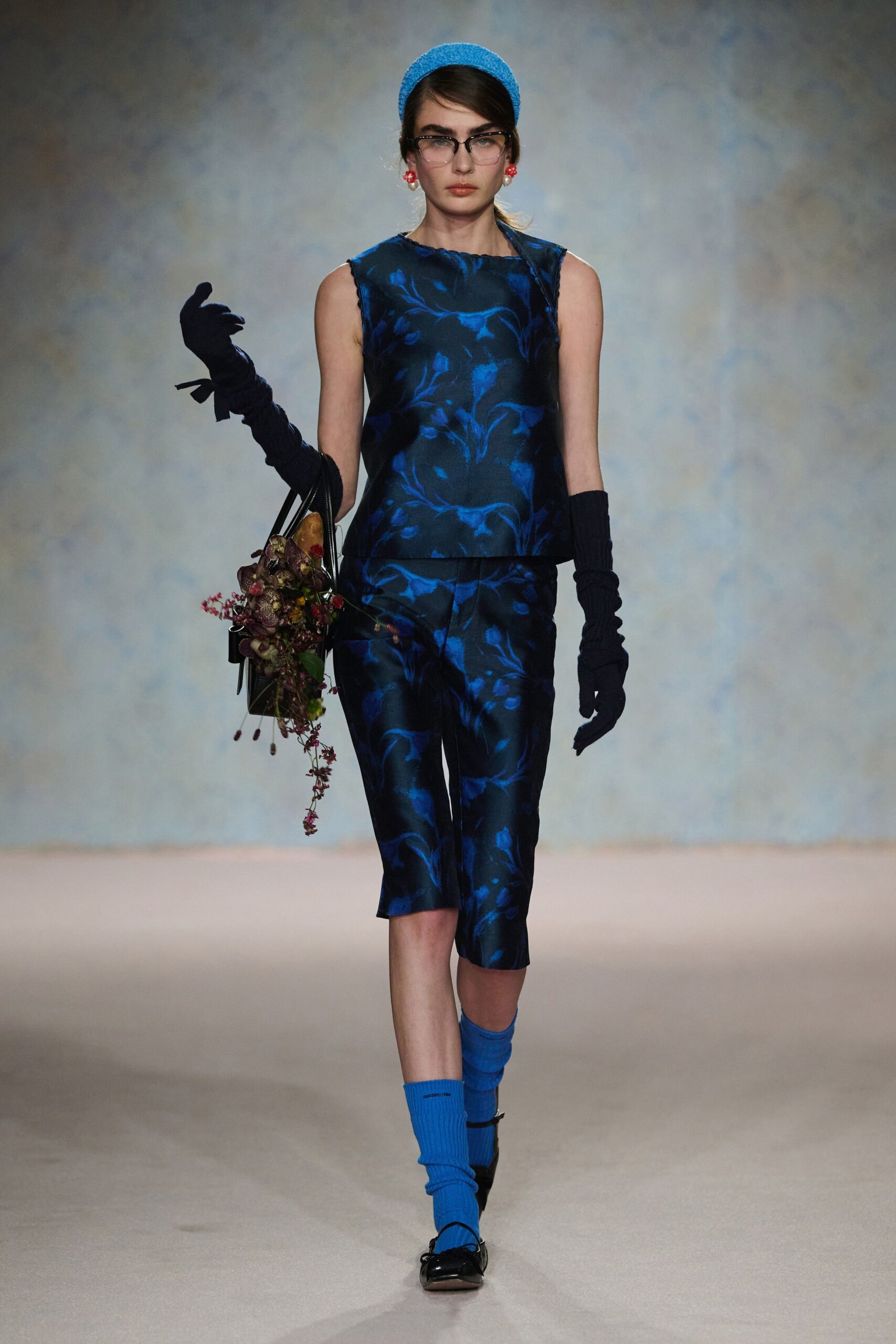 blue silk sleeveless high-neck fitted floral top