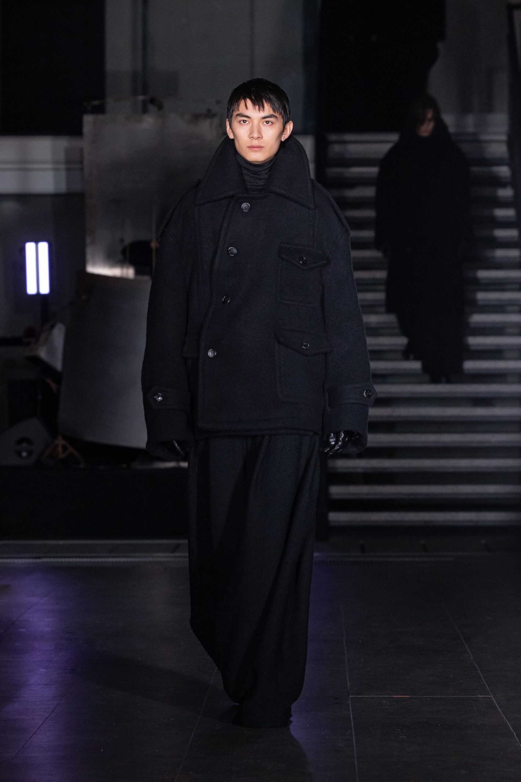 oversized black wool coat and relaxed pants