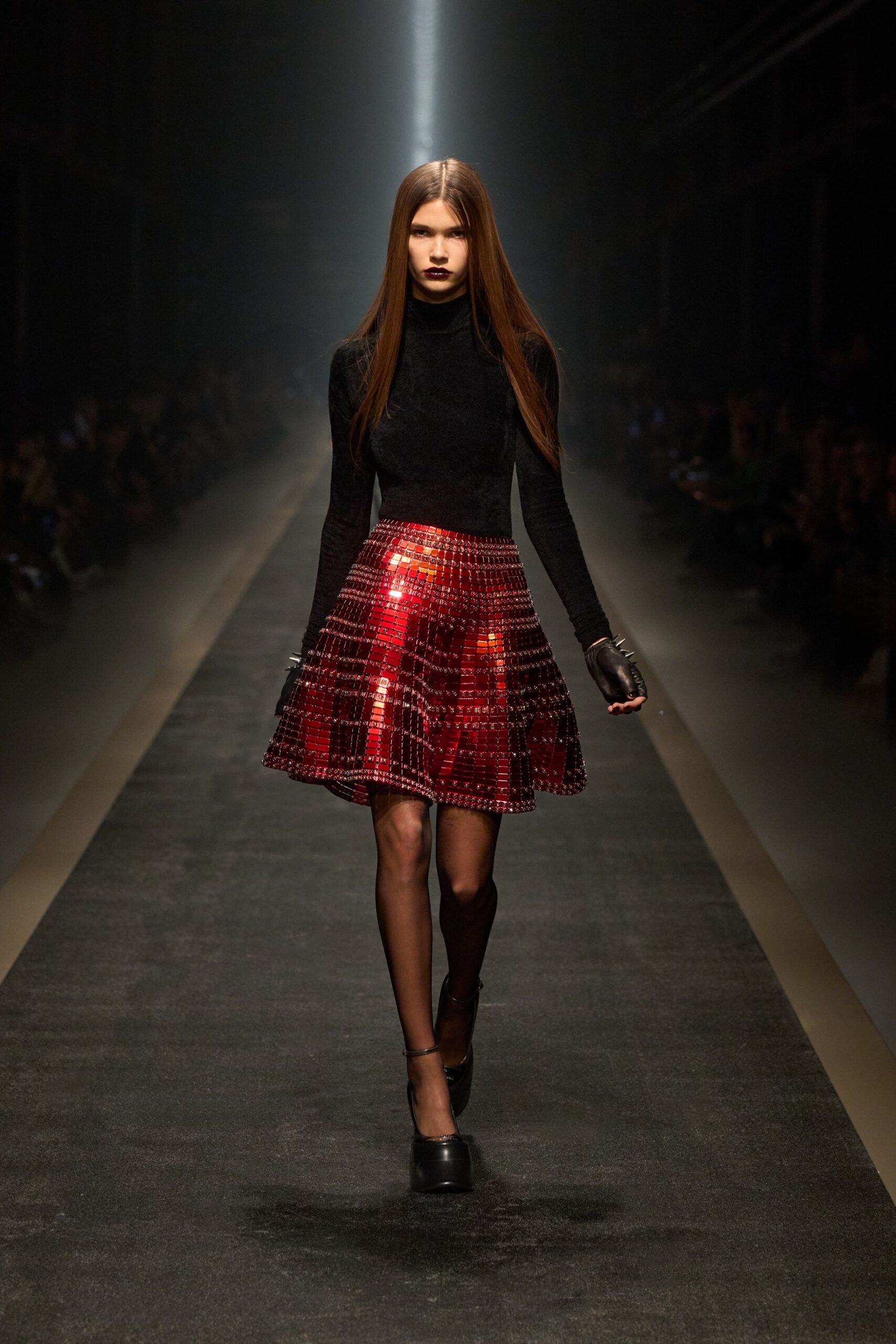 black fitted top red pleated skirt