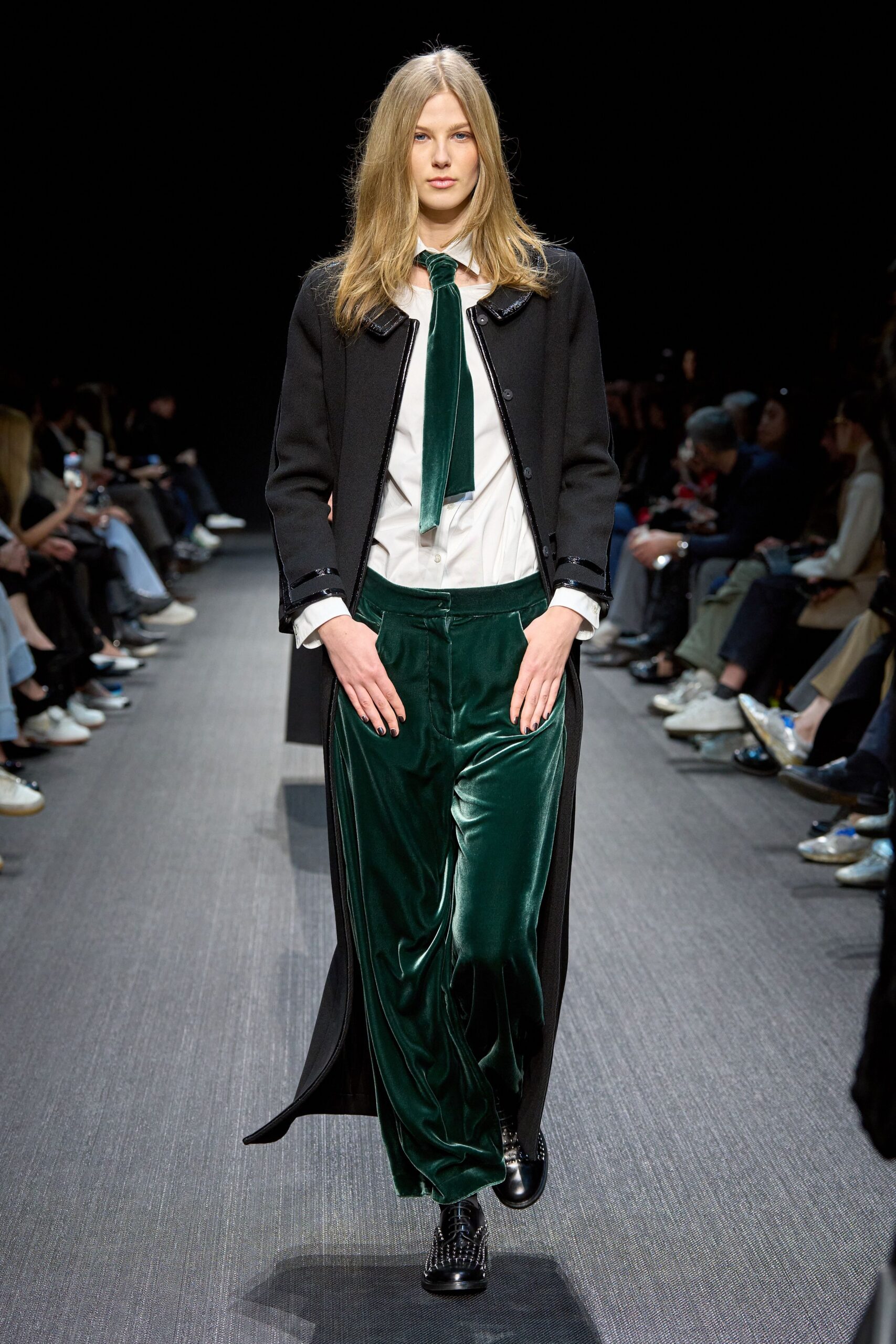 black coat white shirt green pants