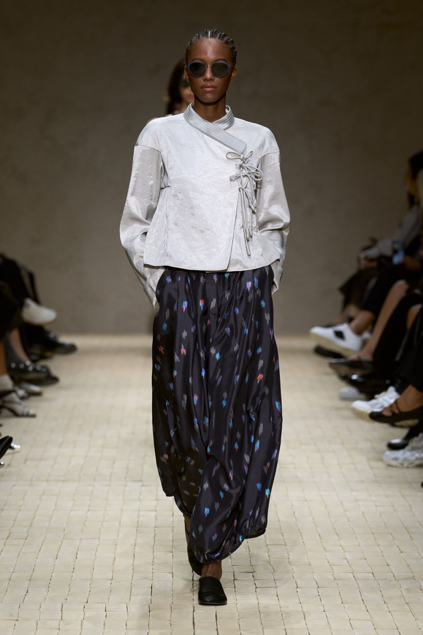 white silk relaxed jacket with multi-colored pants