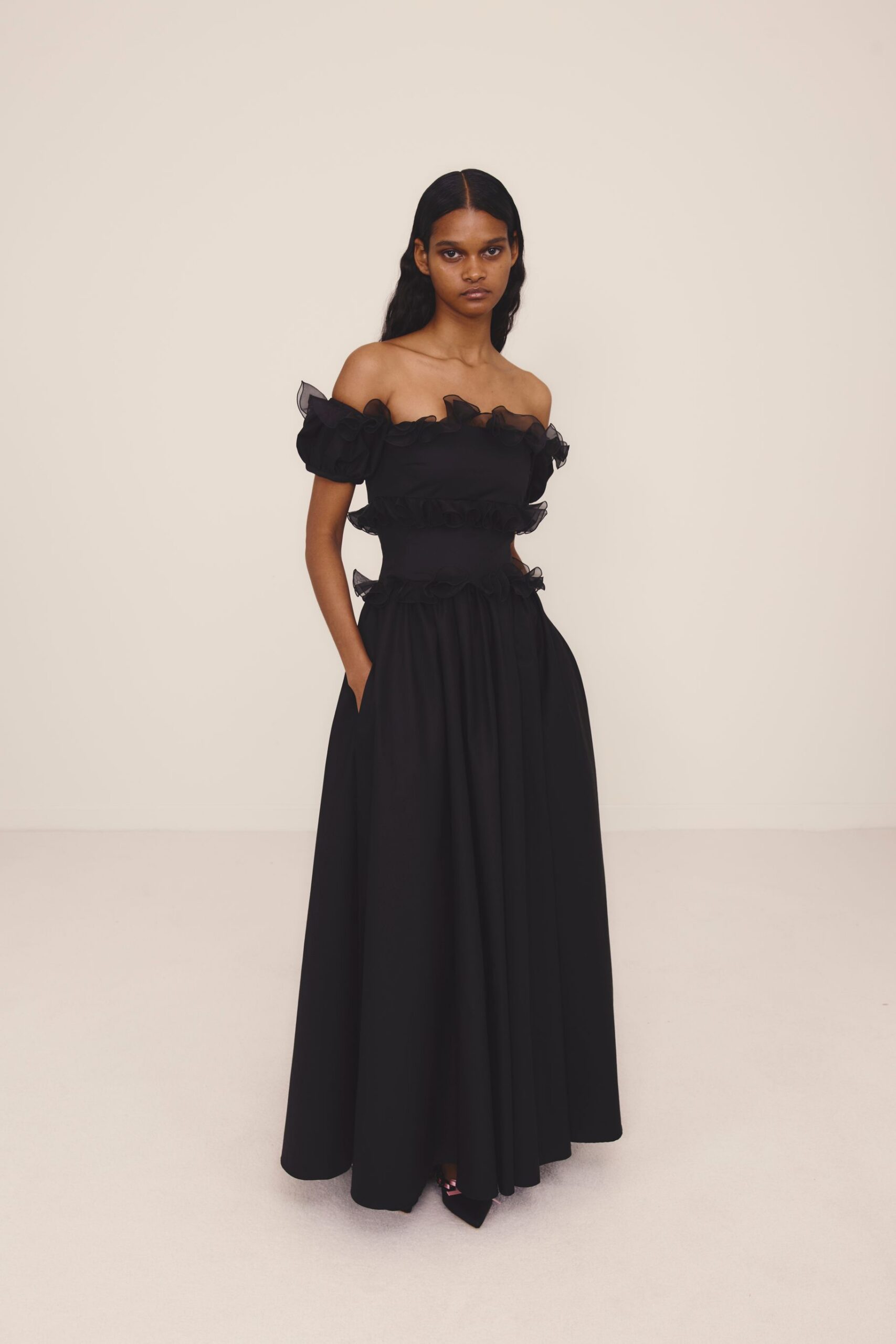 black off-shoulder ruffled gown