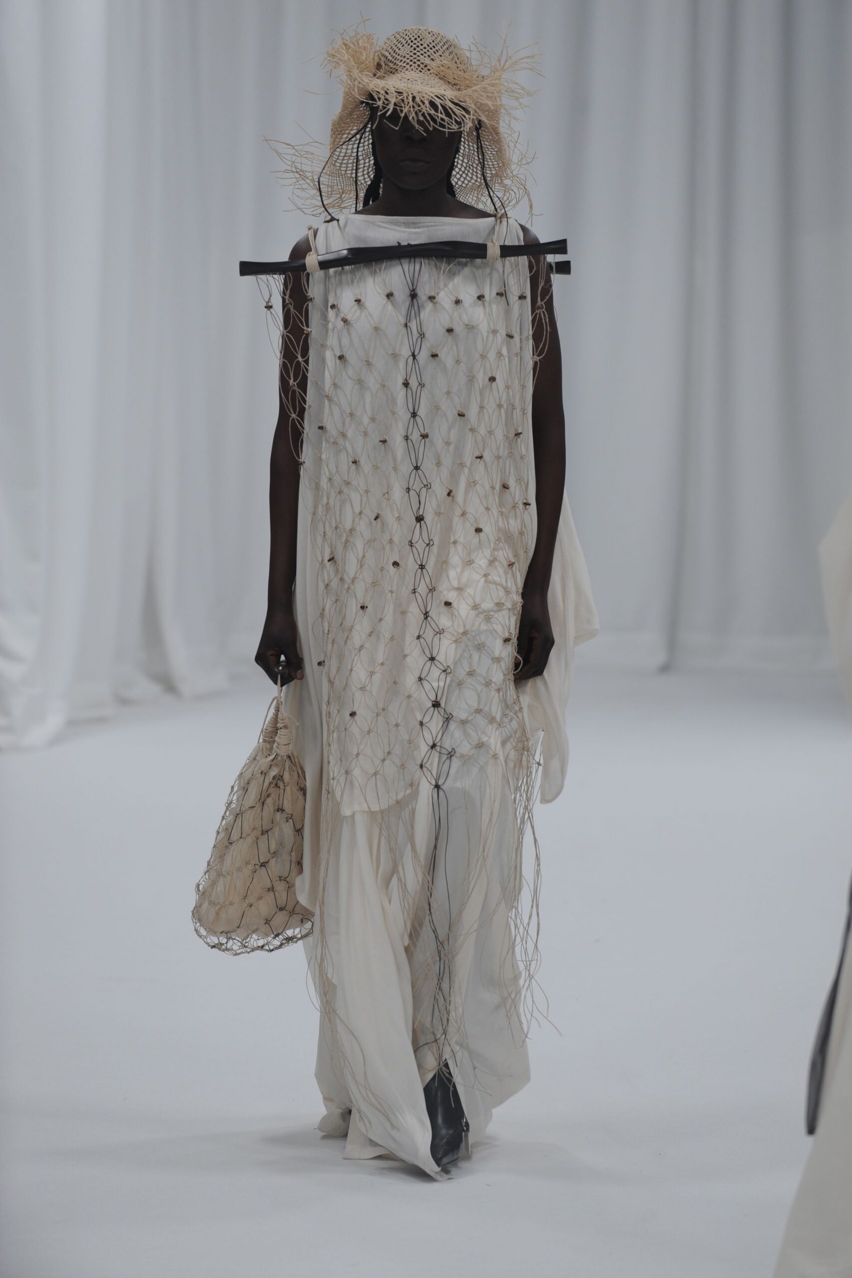white relaxed sleeveless dress with accessories