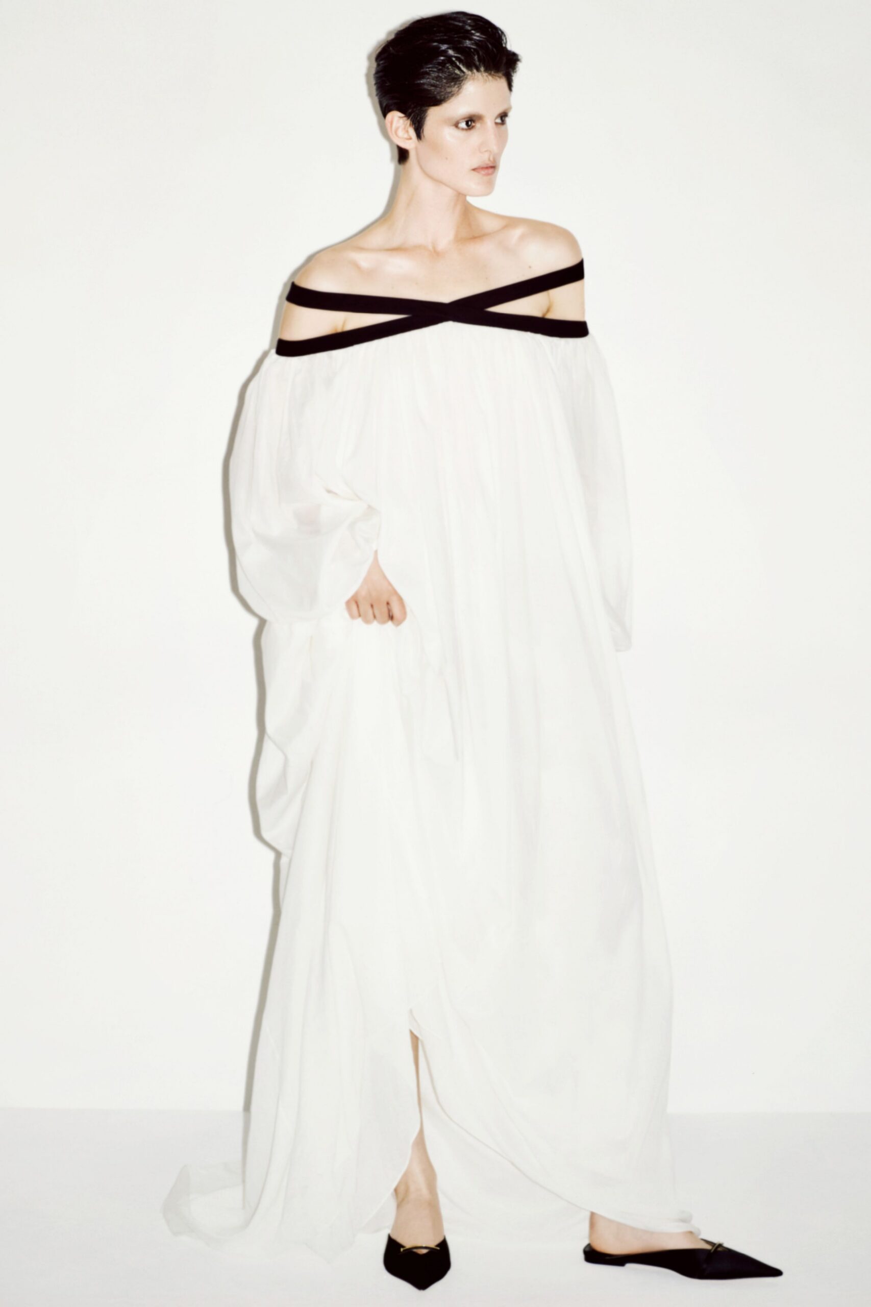 white silk off-shoulder long-sleeve relaxed flowing maxi gown