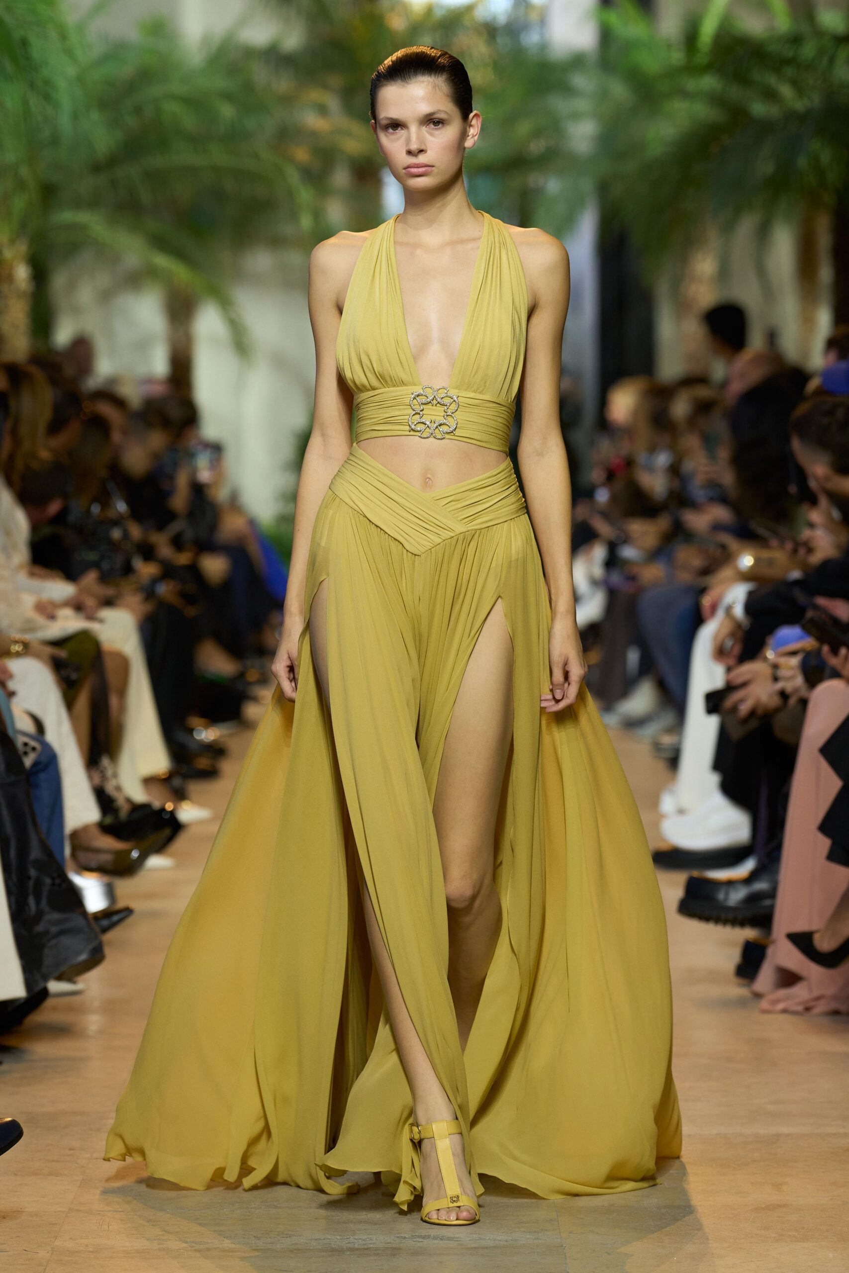 yellow silk sleeveless v-neck fitted pleated flowing gown