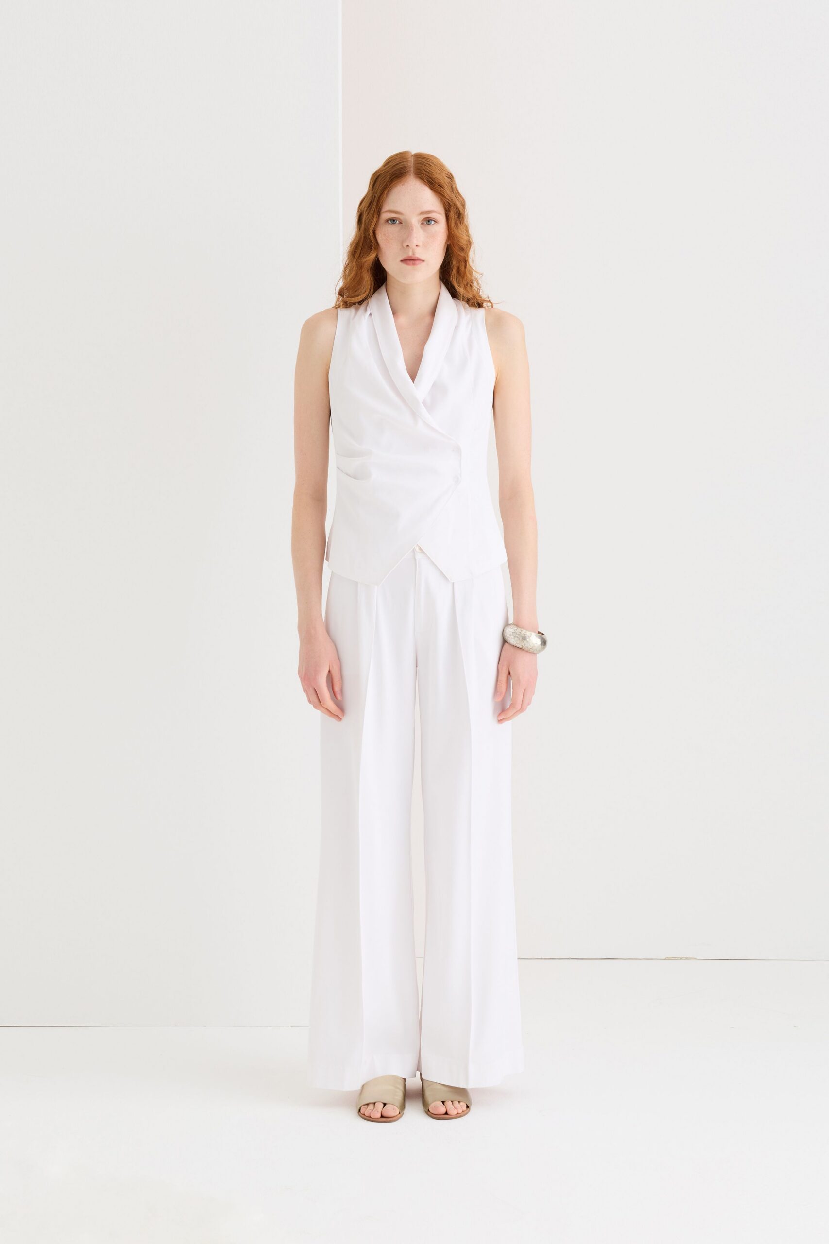 white draped top and wide-leg pants