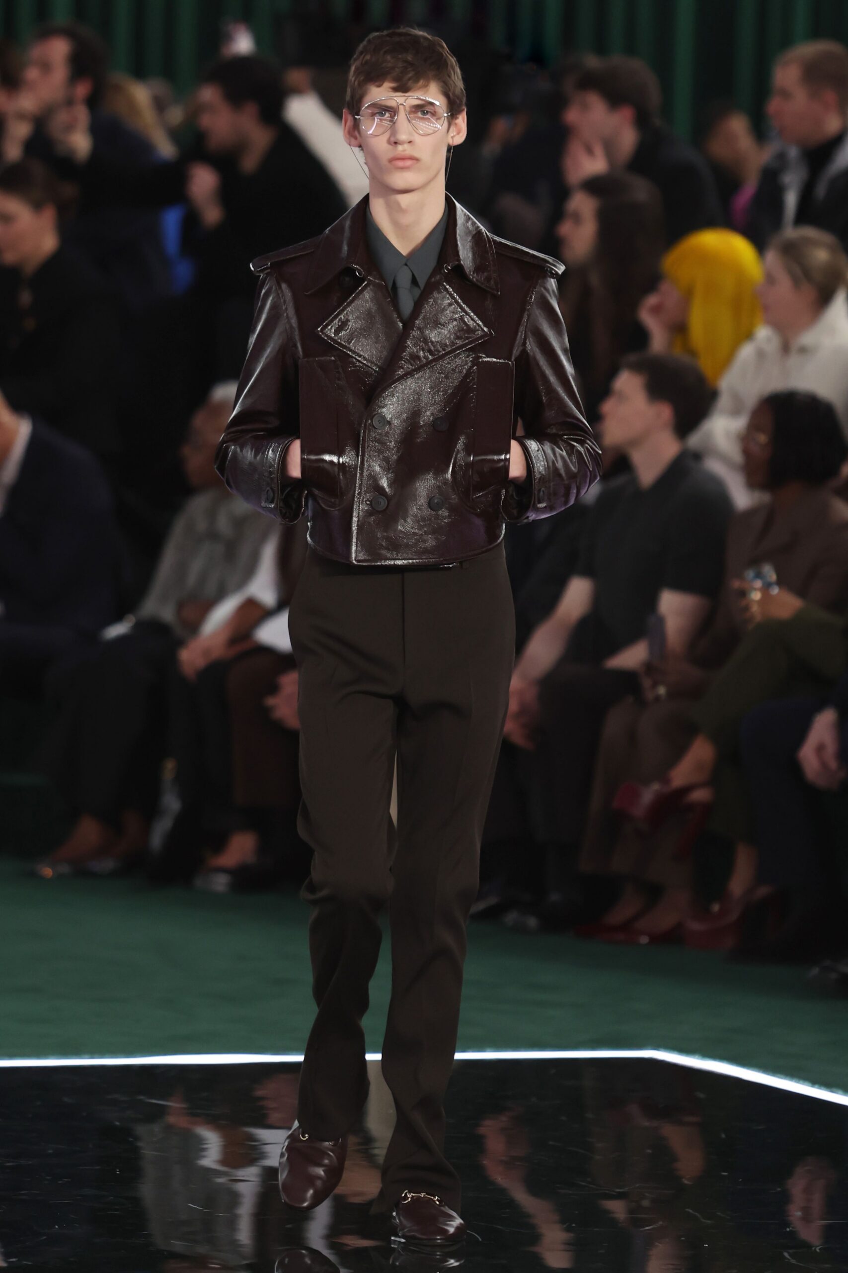 brown leather jacket with black pants