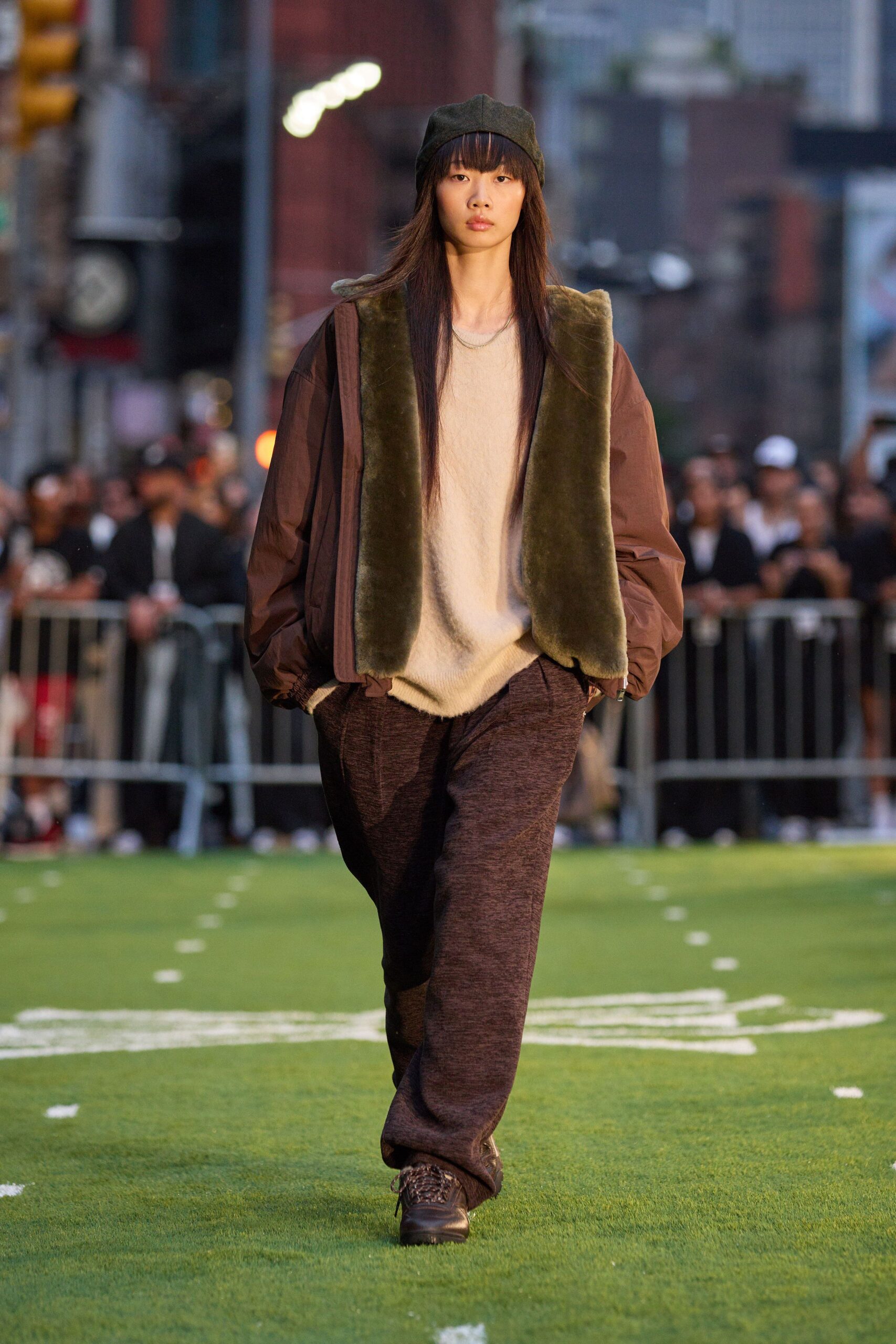 brown faux-fur jacket with beige sweater