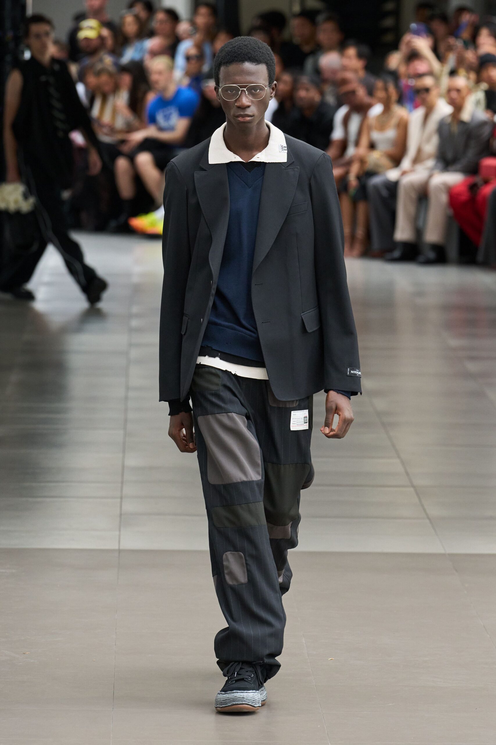 black blazer navy sweater gray pants