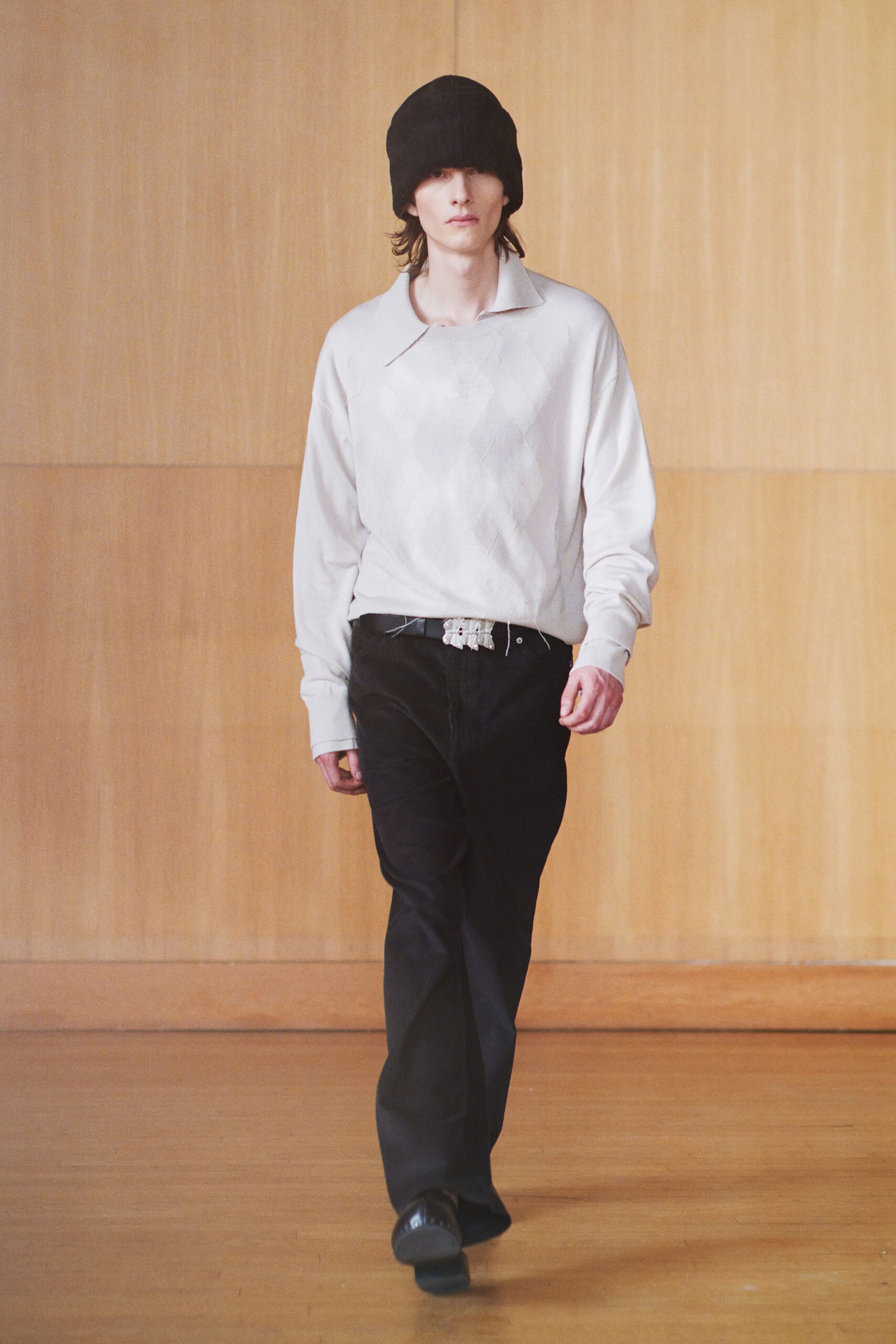 white argyle sweater with black pants