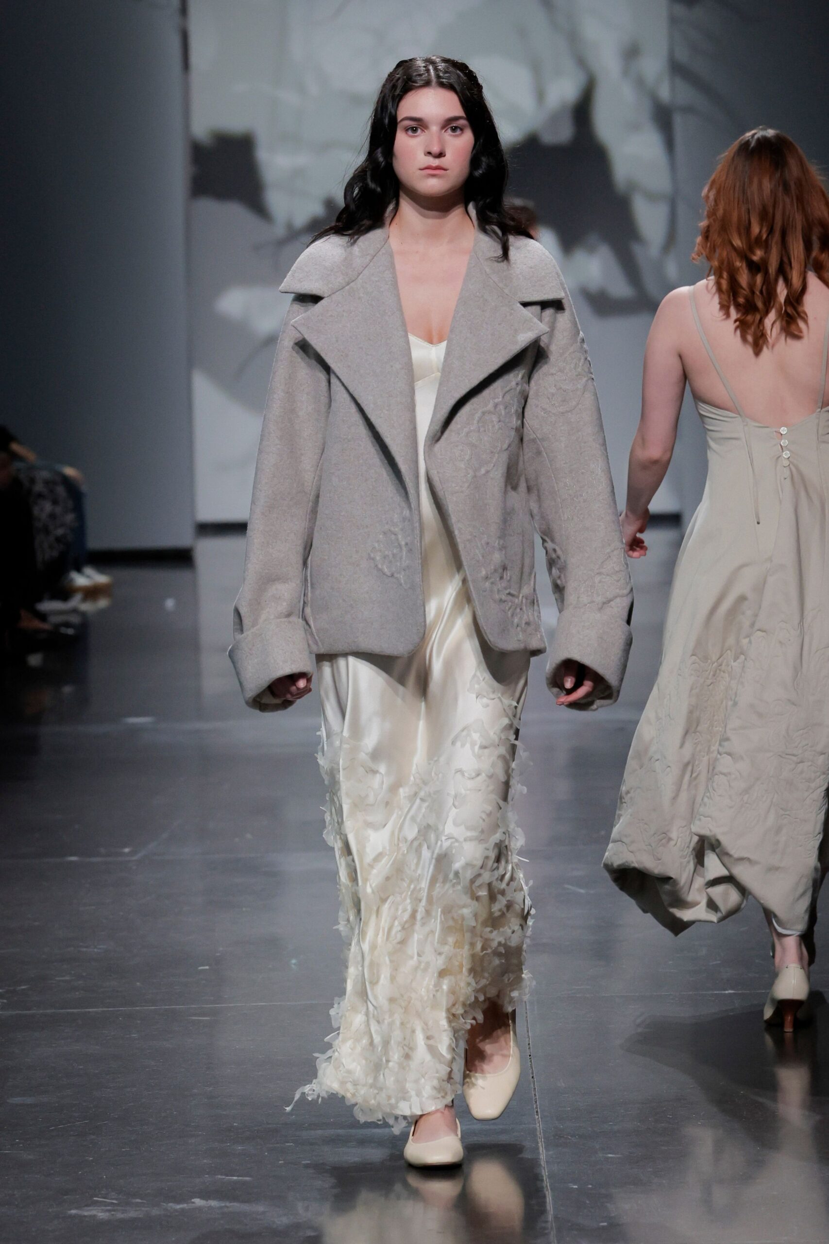 gray oversized coat and white gown