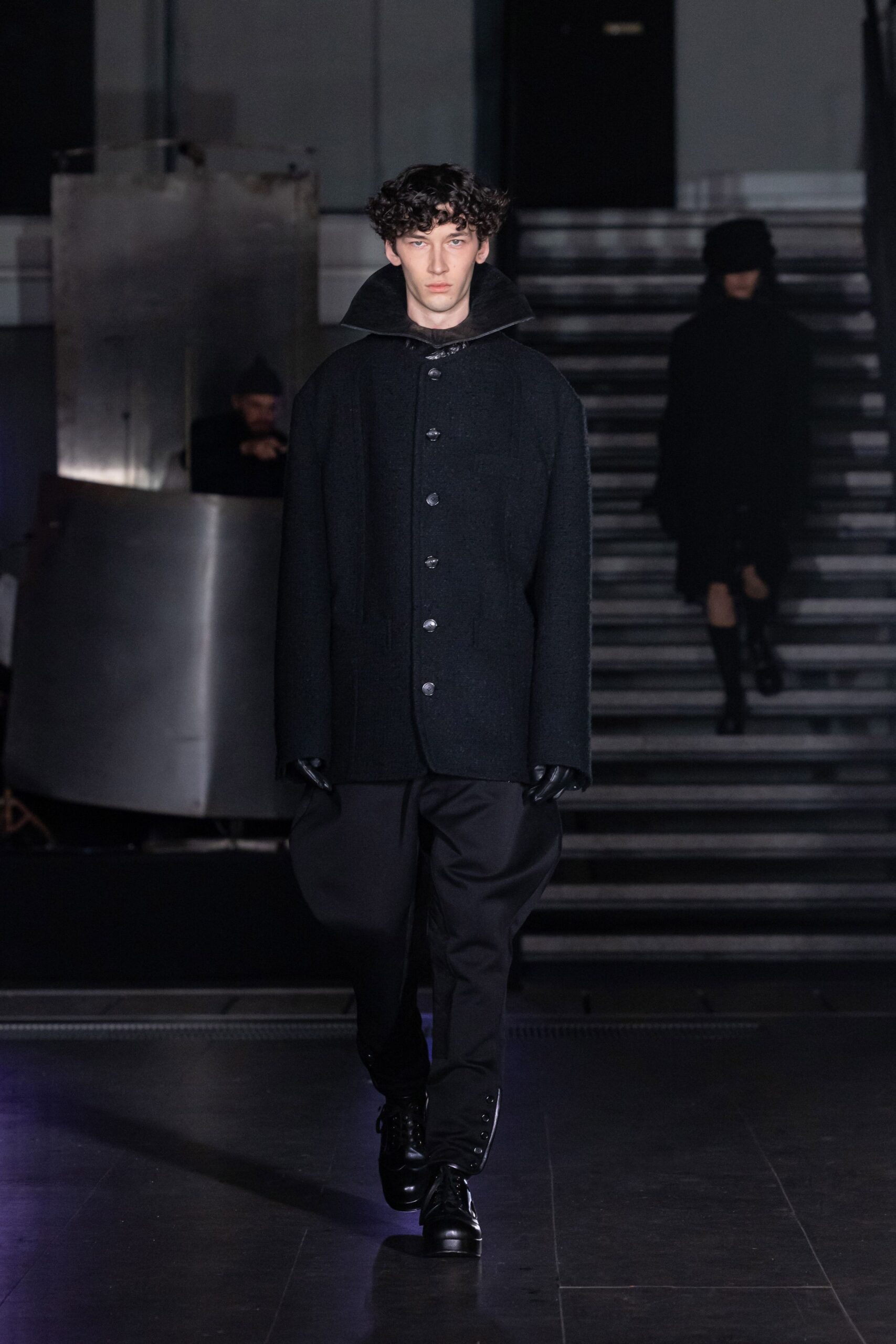 black wool coat with relaxed pants