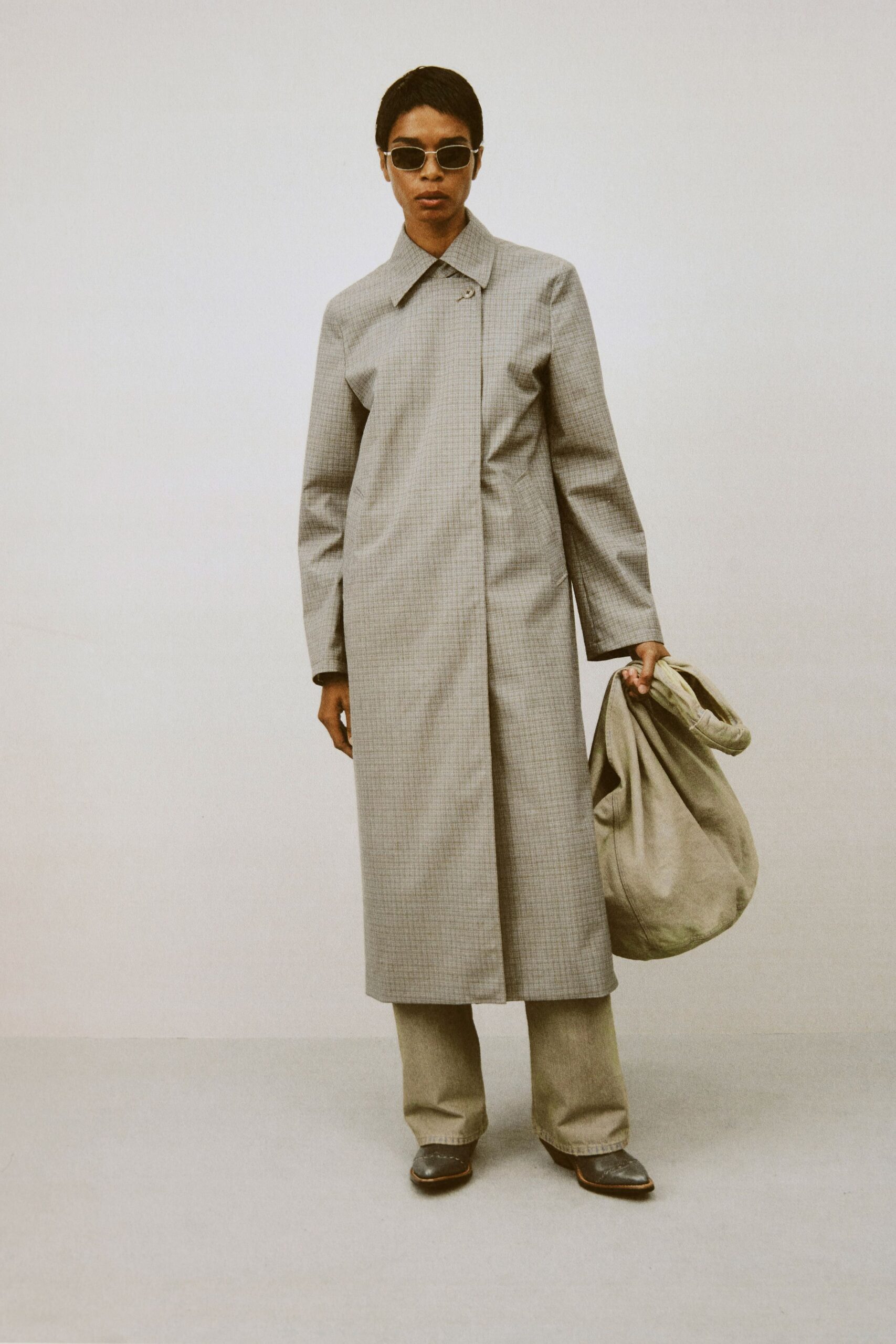 gray checked coat with beige pants