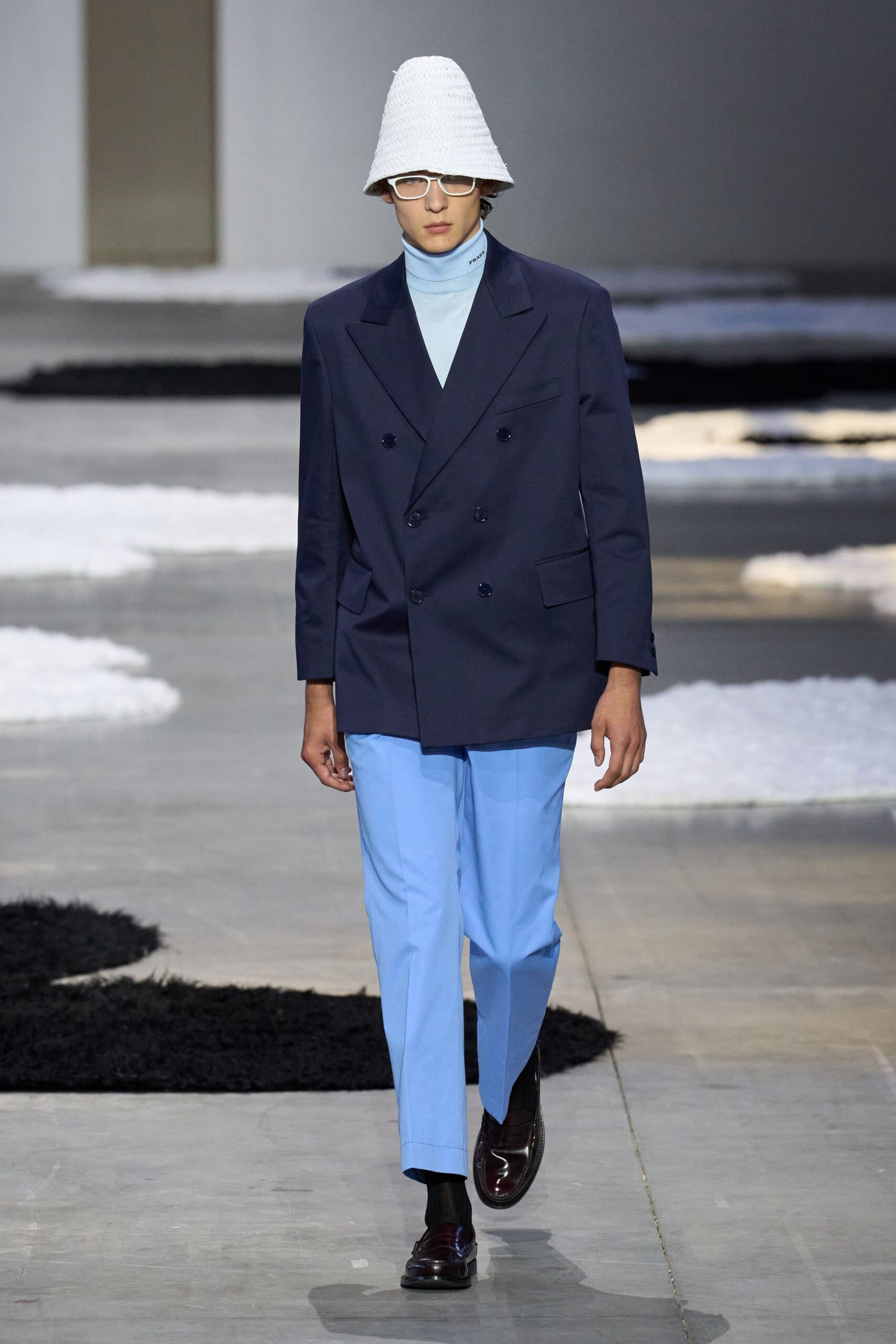 navy tailored blazer with light blue turtleneck