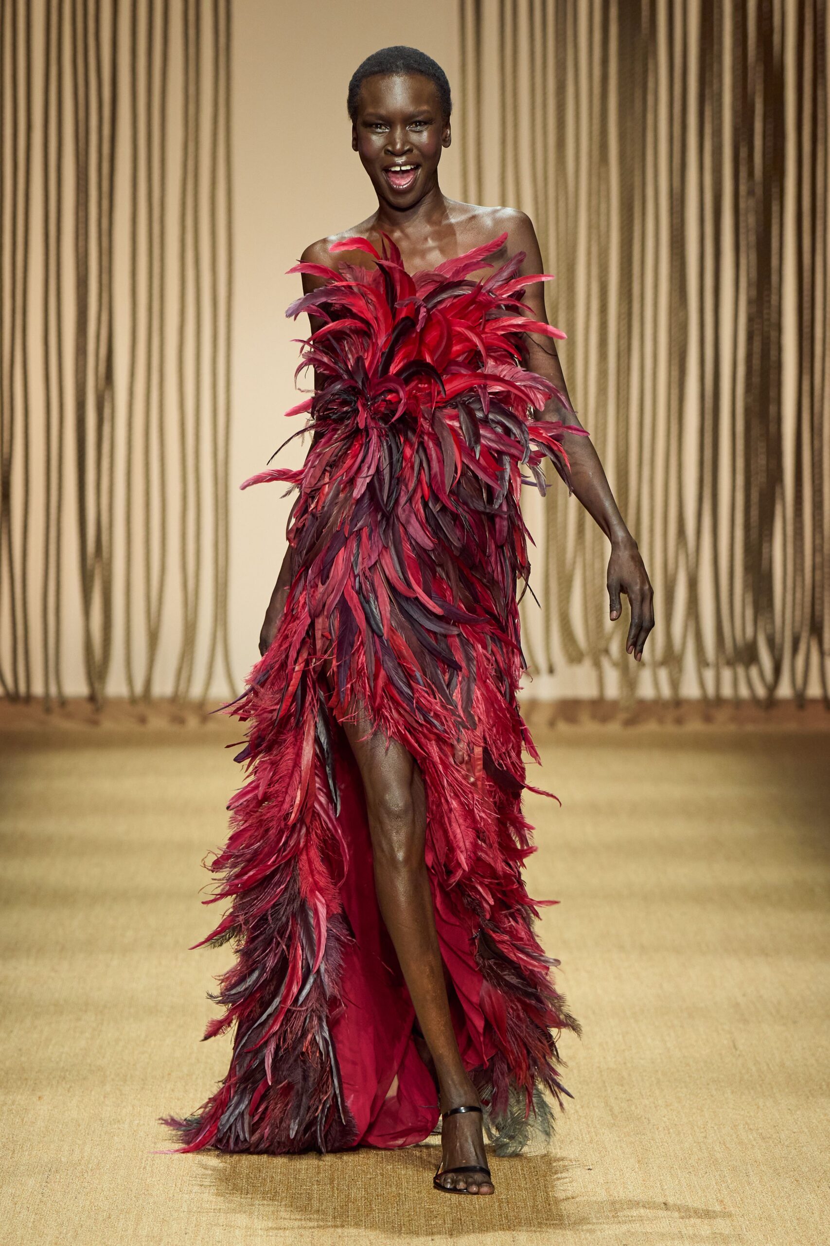 red silk sleeveless off-shoulder fitted fringed layered gown